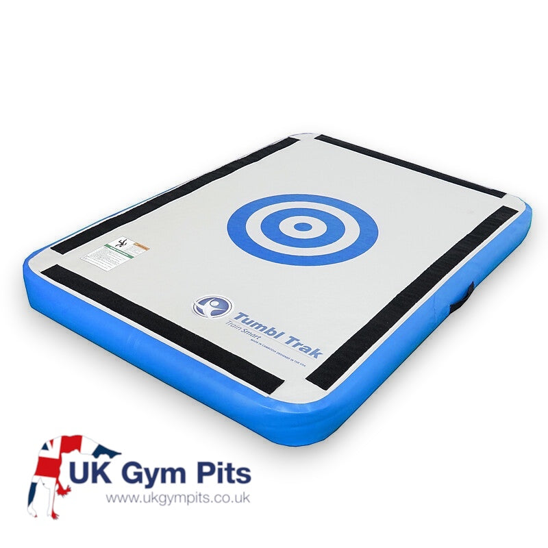 UK Gym Pits blue and grey inflatable launch pad for gymnastics training with a circular target design on top