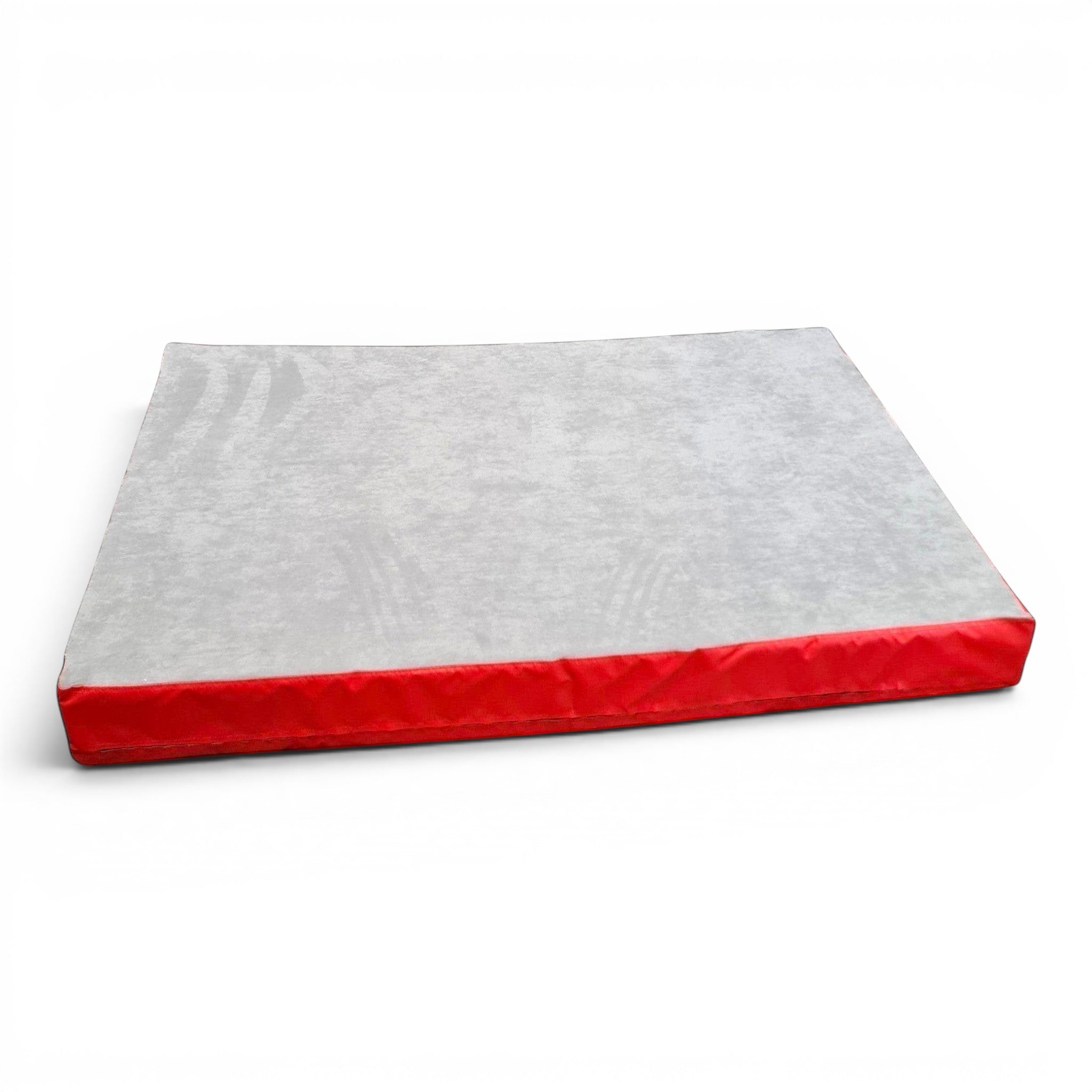 UK Gym Pits jersey-topped crash mat with a grey fabric surface and red PVC sides for gymnastics and martial arts.