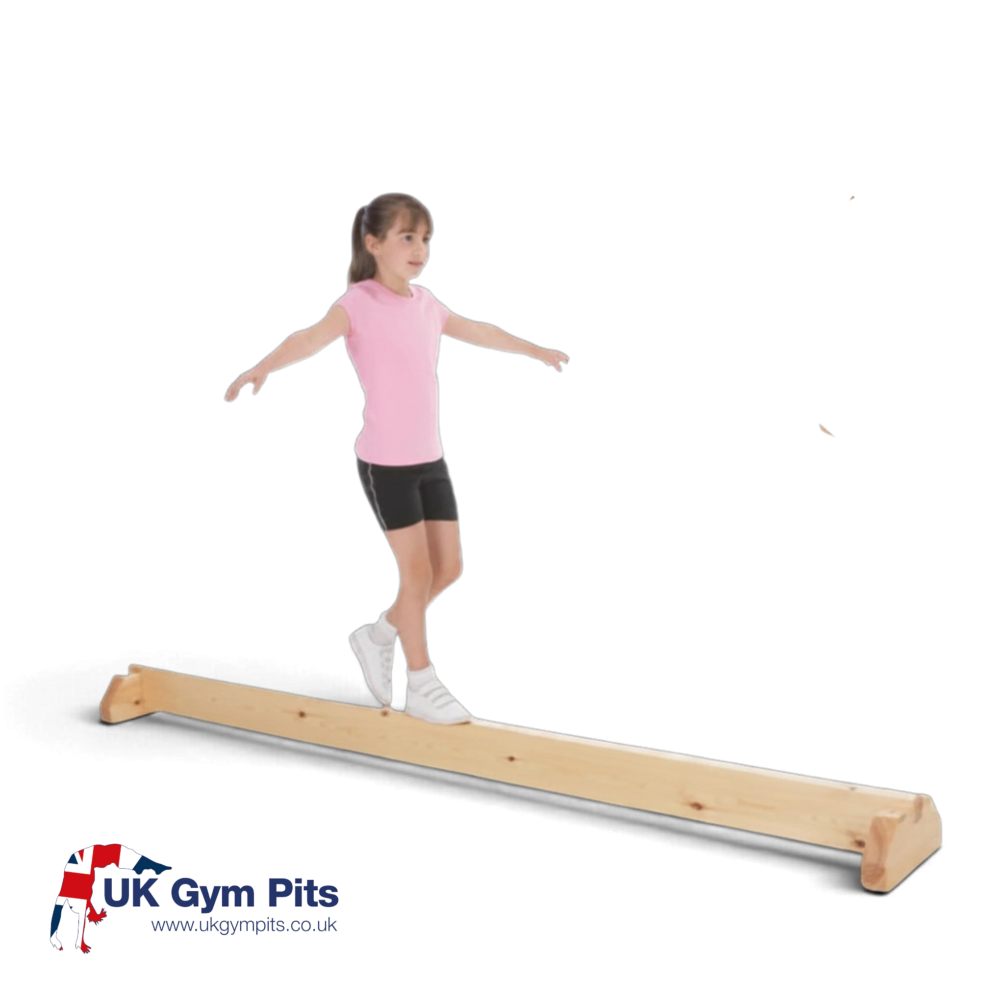 Young girl practicing on a UK Gym Pits junior natural timber balance beam with stable wooden support legs.