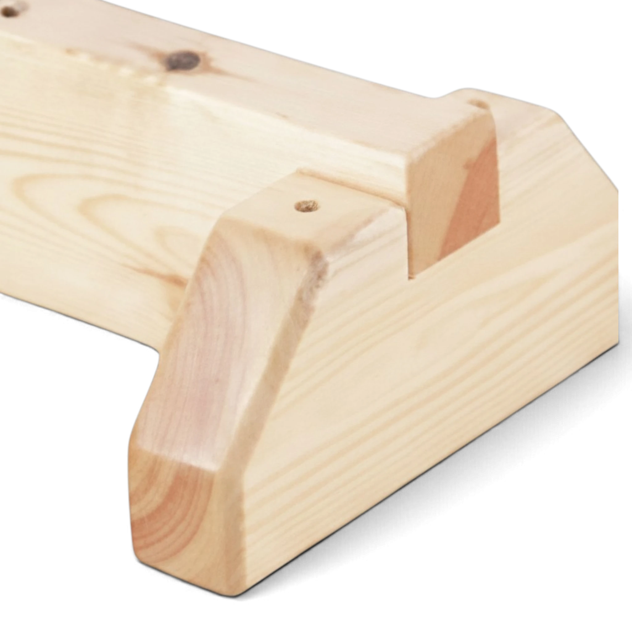 Young girl practicing gymnastics on a UK Gym Pits junior natural timber balance beam with stable wooden supports.