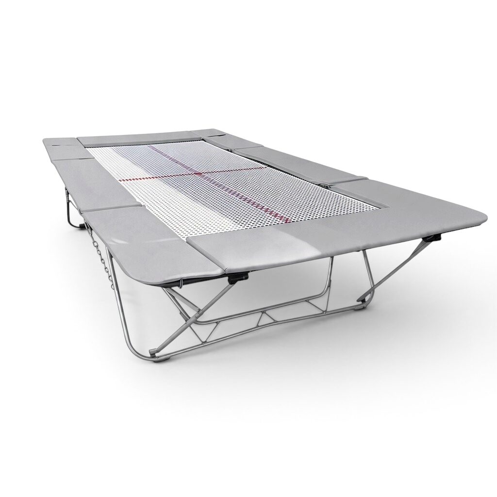 UK Gym Pits junior trampoline with a white web bed and grey protective frame pads for gymnastics and home training