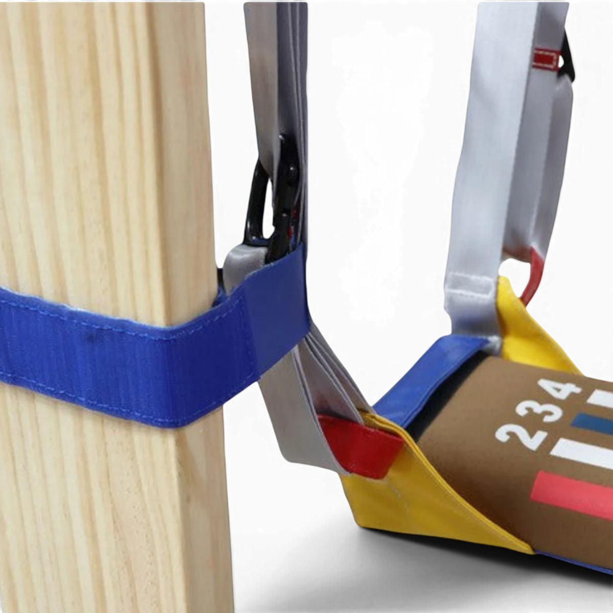 UK Gym Pits Laser Balance Beam Hammock with adjustable straps and Velcro attachment secured to a wooden post