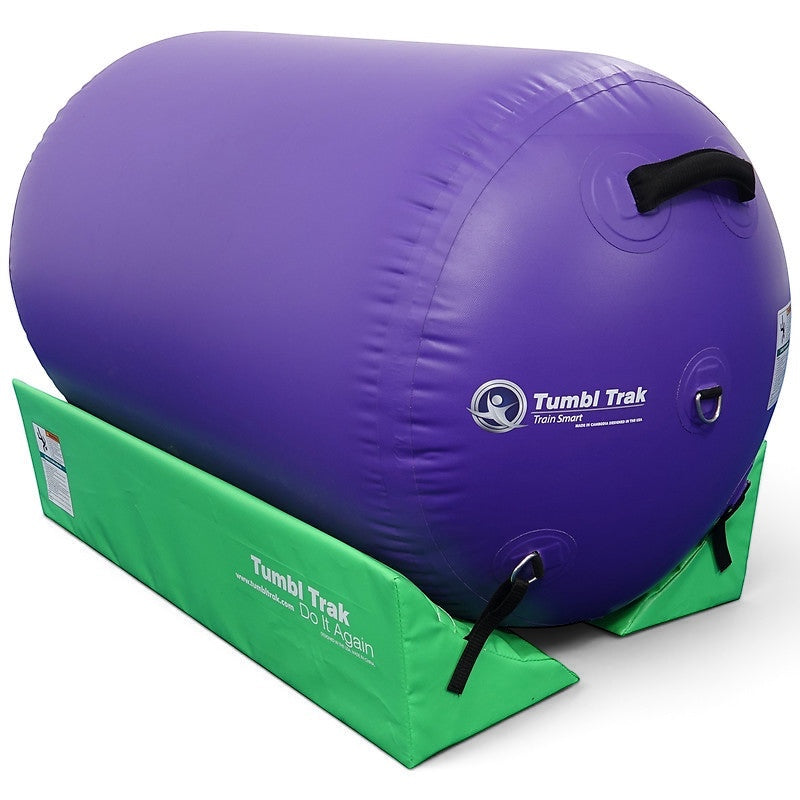 UK Gym Pits lime green foam cradle stabilizing a large purple inflatable air barrel for gymnastics training