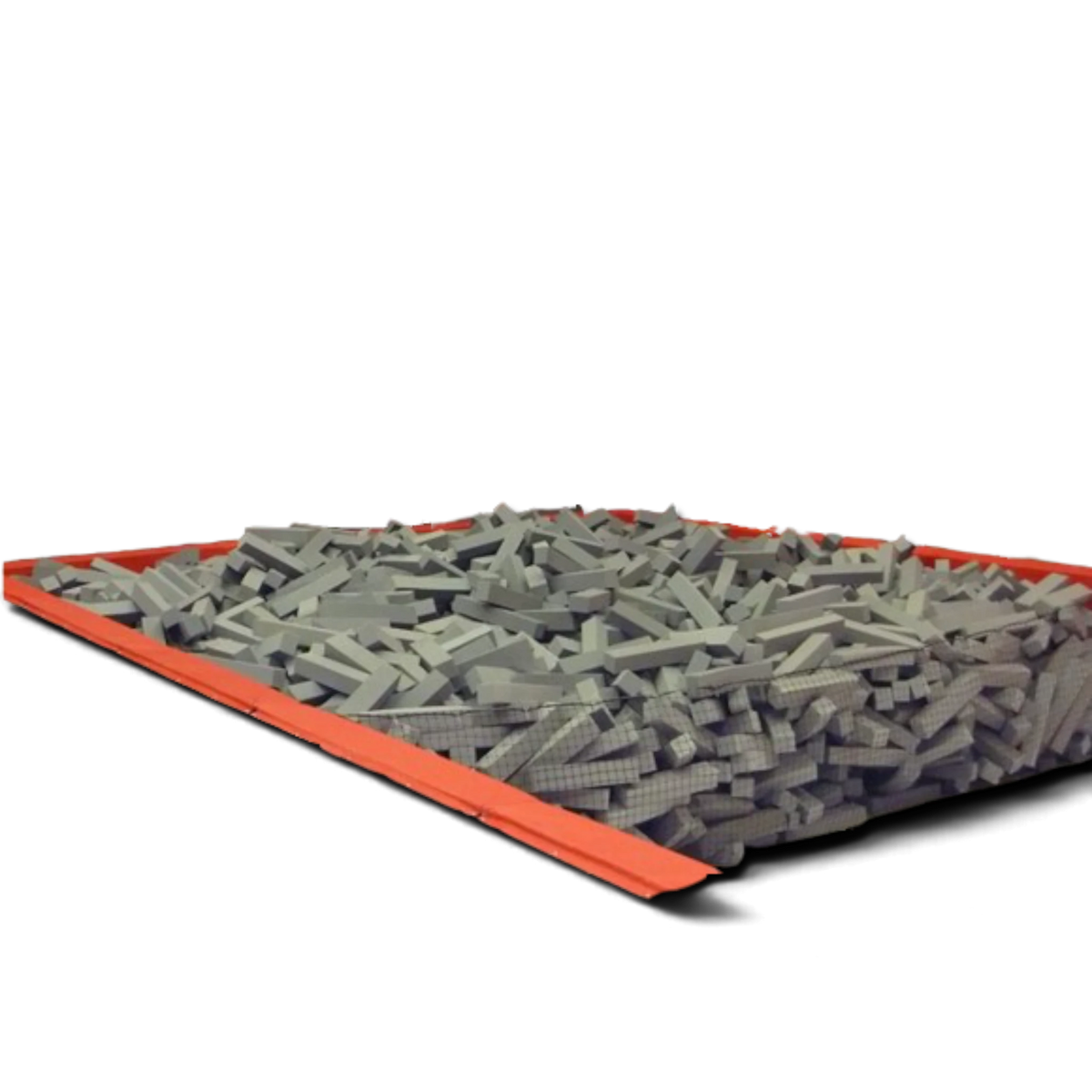 UK Gym Pits loose grey foam logs filling a landing pit for gymnastics safety and impact absorption