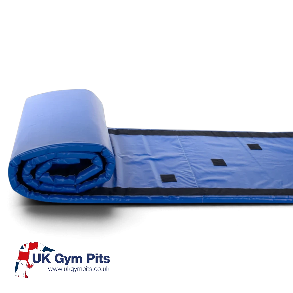 UK Gym Pits Magic Carpet Roll in blue with Velcro strips for soft play, ideal for gymnastics and motor skill practice.