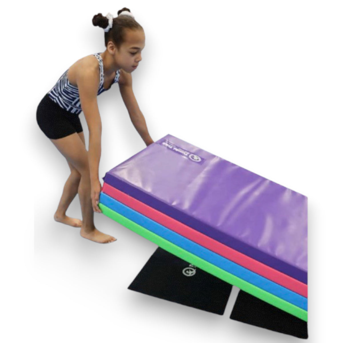 UK Gym Pits non-slip smart mat sheets placed under a stack of colourful vinyl gym mats with a young gymnast
