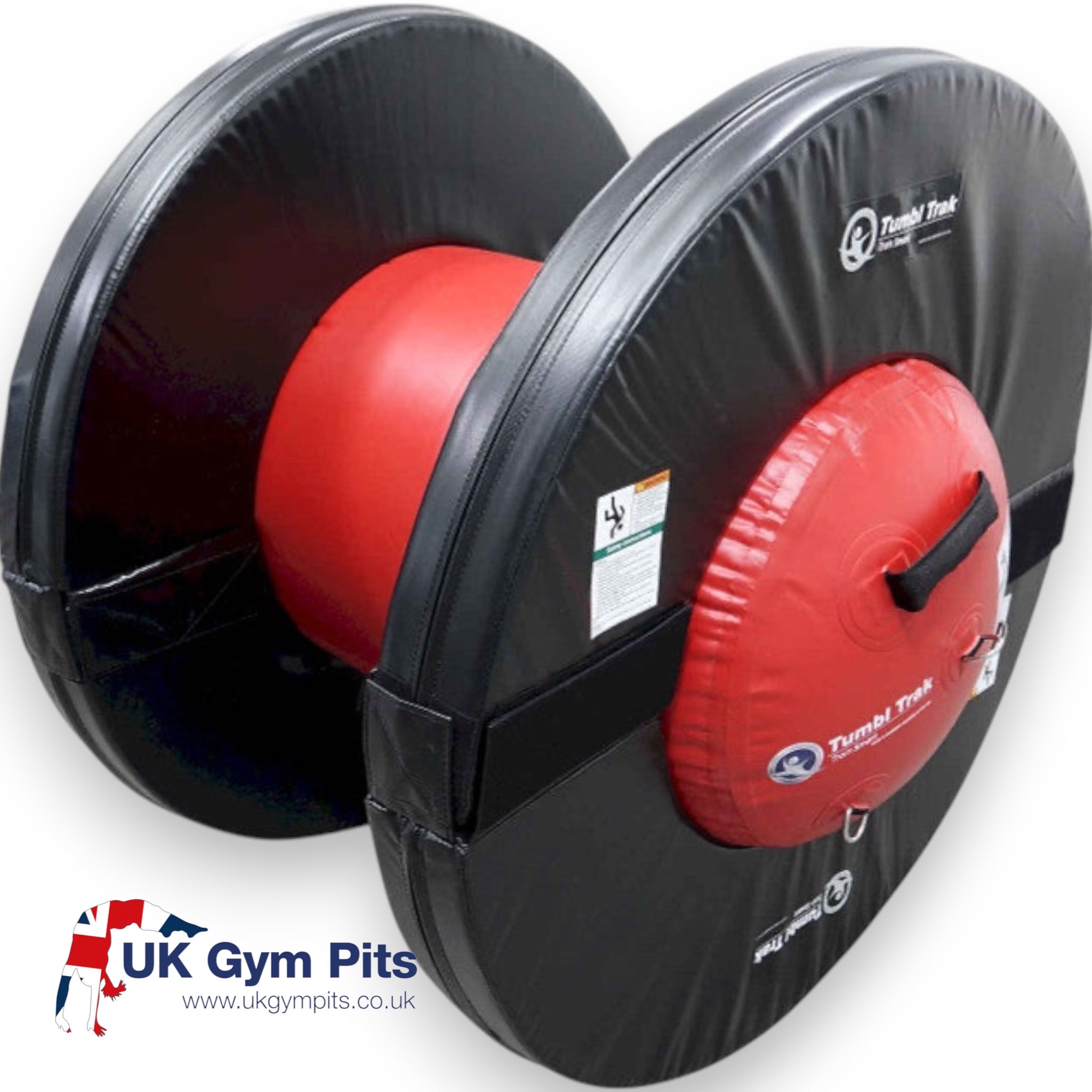 UK Gym Pits Orbiter gymnastics training tool with a red inflatable air barrel and black foam rings on a white floor.