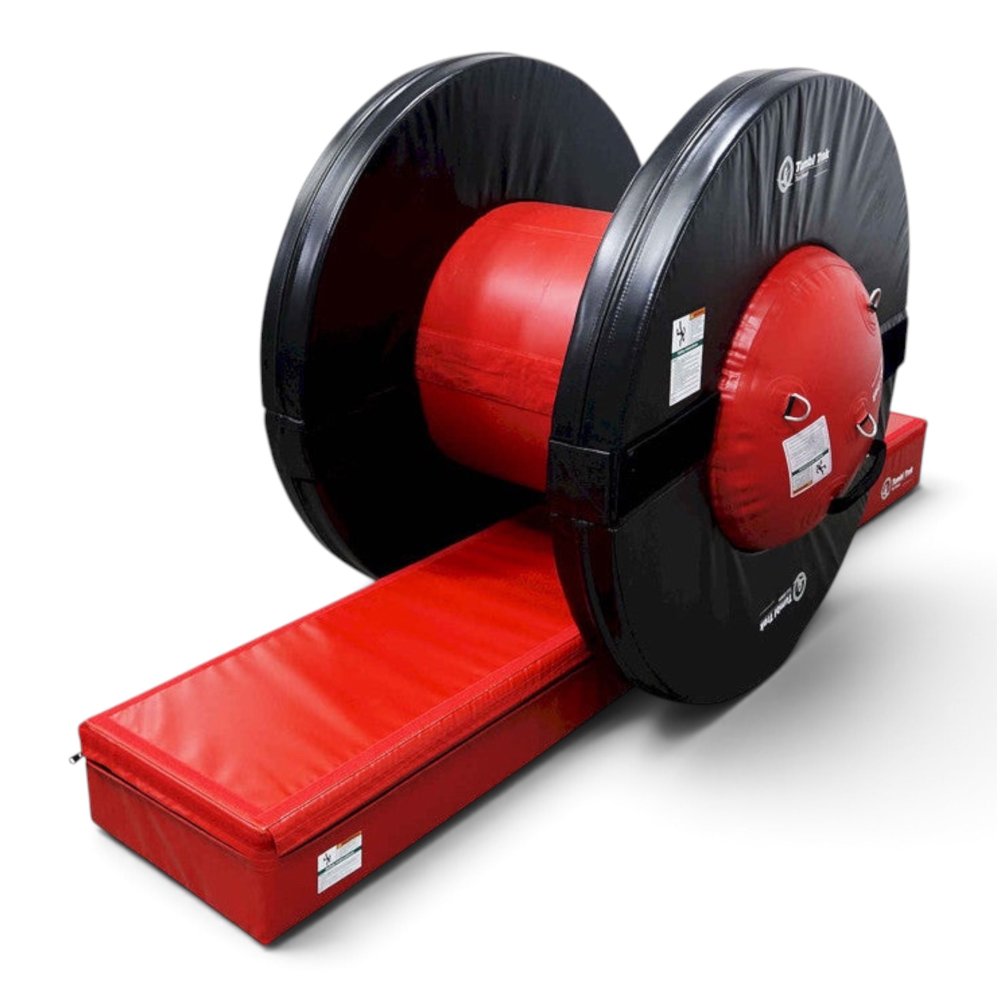 UK Gym Pits Orbiter gymnastics training tool with a red air barrel and black foam rings on a red floor mat