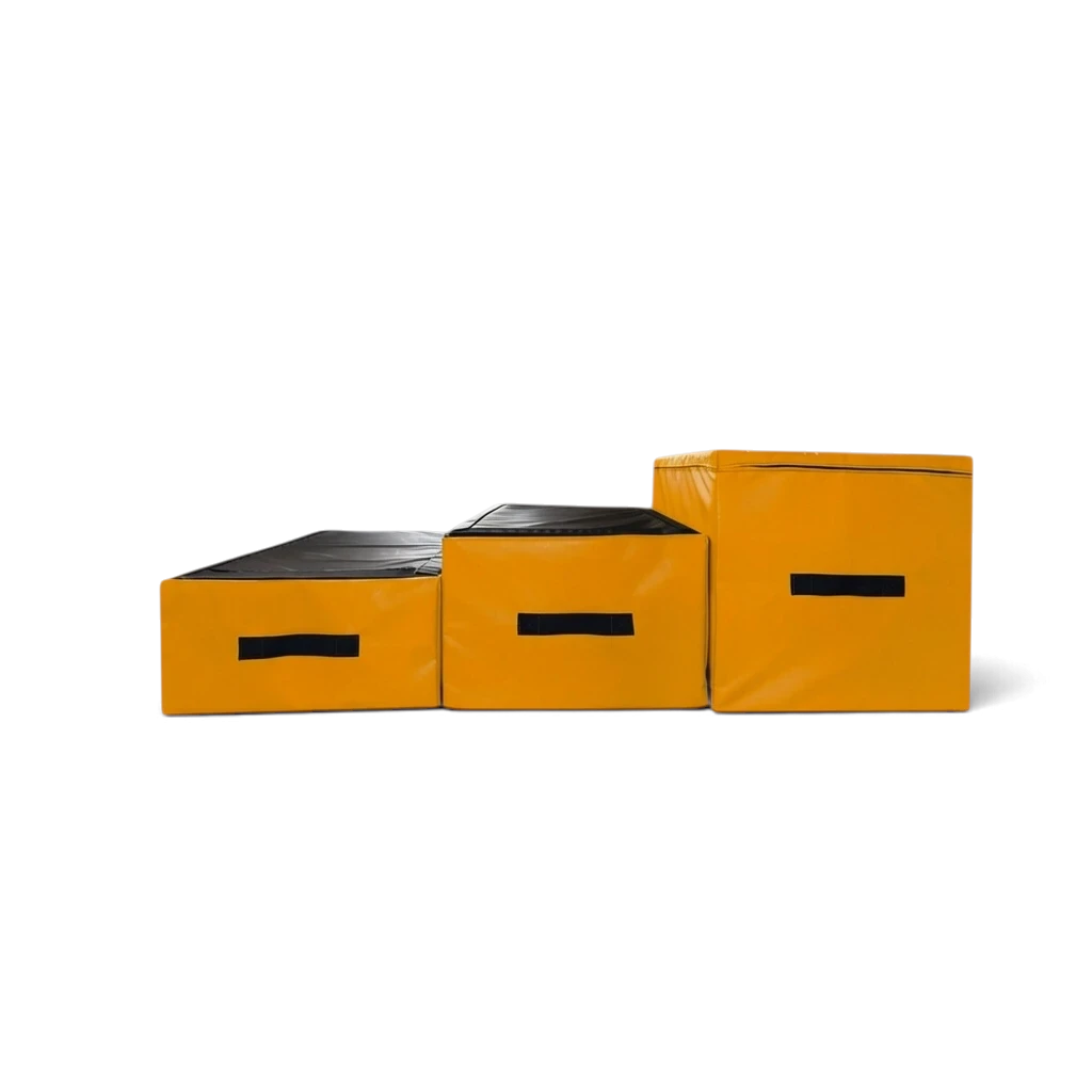 UK Gym Pits parkour jumping blocks in black and yellow with carry handles, arranged in a step formation.