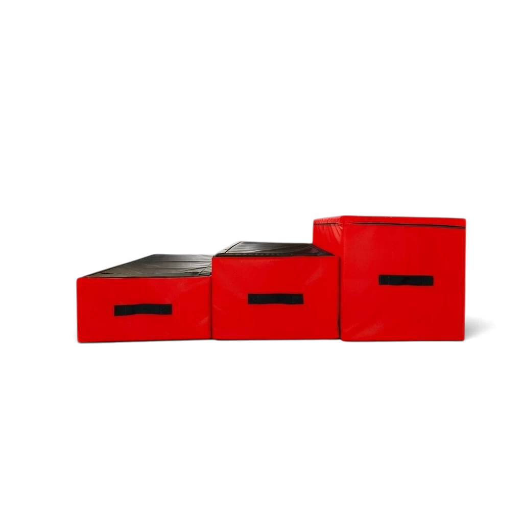 UK Gym Pits parkour jumping blocks in red and black PVC with carry handles arranged in a step formation