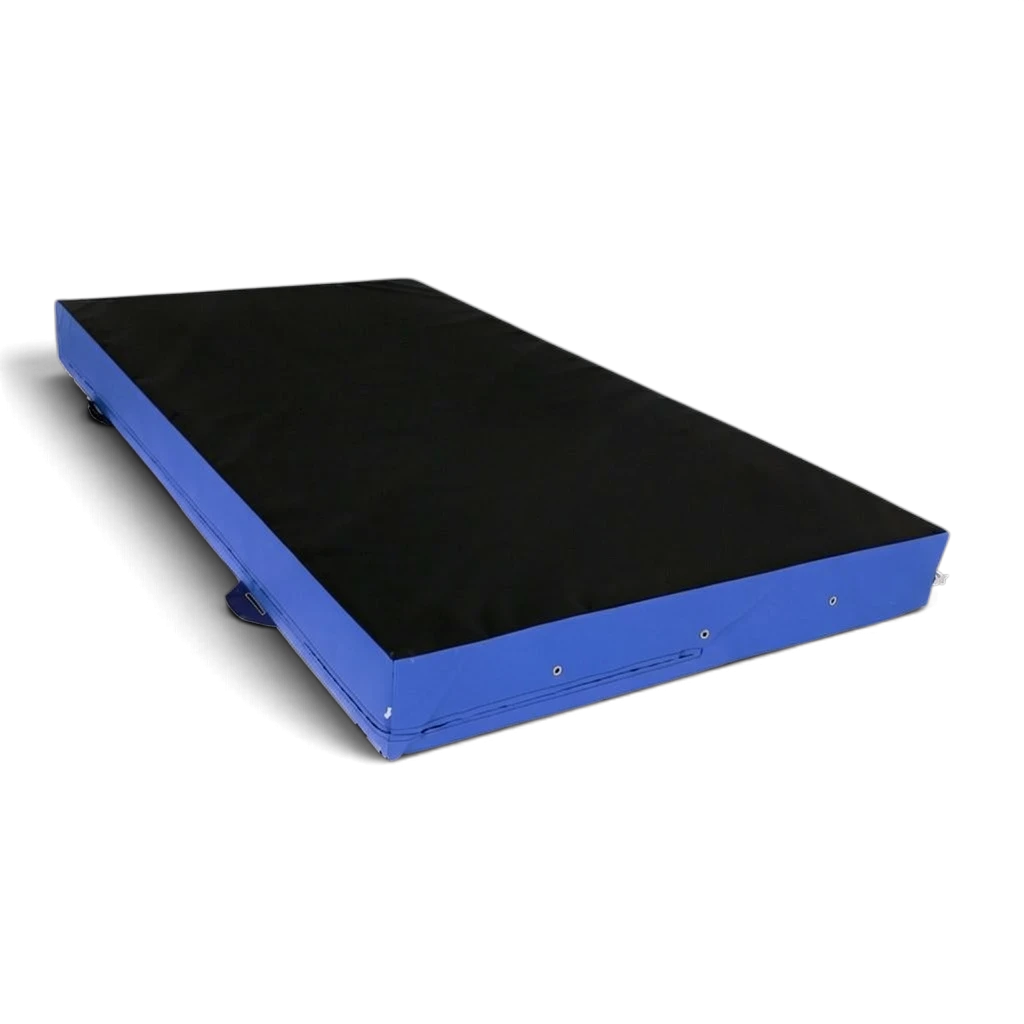 UK Gym Pits parkour landing mat with a black top and blue sides, featuring corner toggles and carry handles.