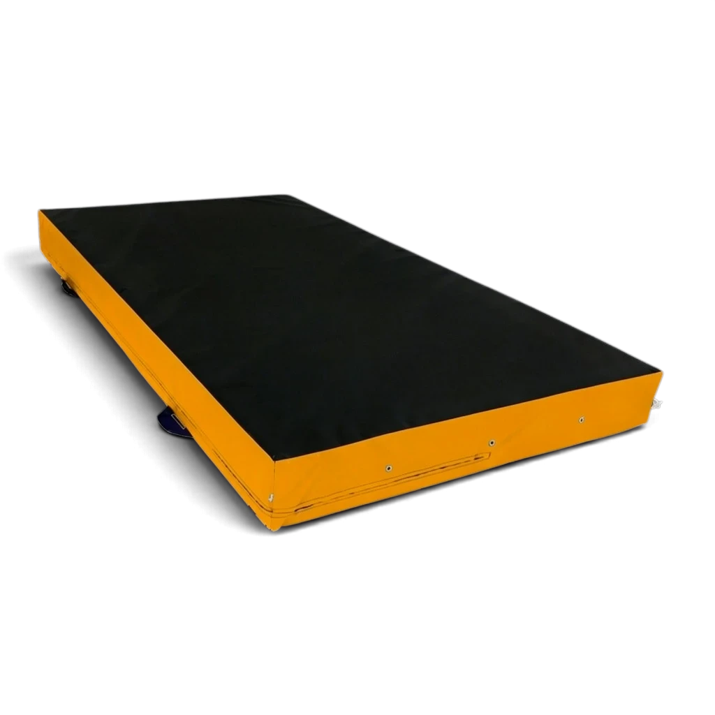 UK Gym Pits parkour landing mat with a black top and yellow sides, featuring corner toggles and carry handles.
