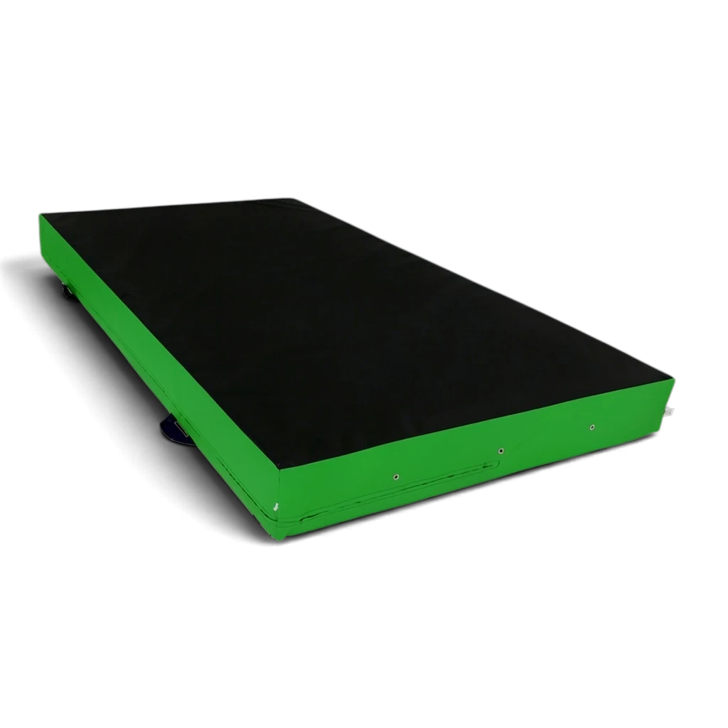 UK Gym Pits parkour landing mat with a black top and green sides, featuring durable PVC and corner toggles.