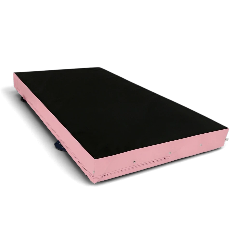 UK Gym Pits parkour landing mat with a black top and pink sides, featuring corner toggles and carry handles.