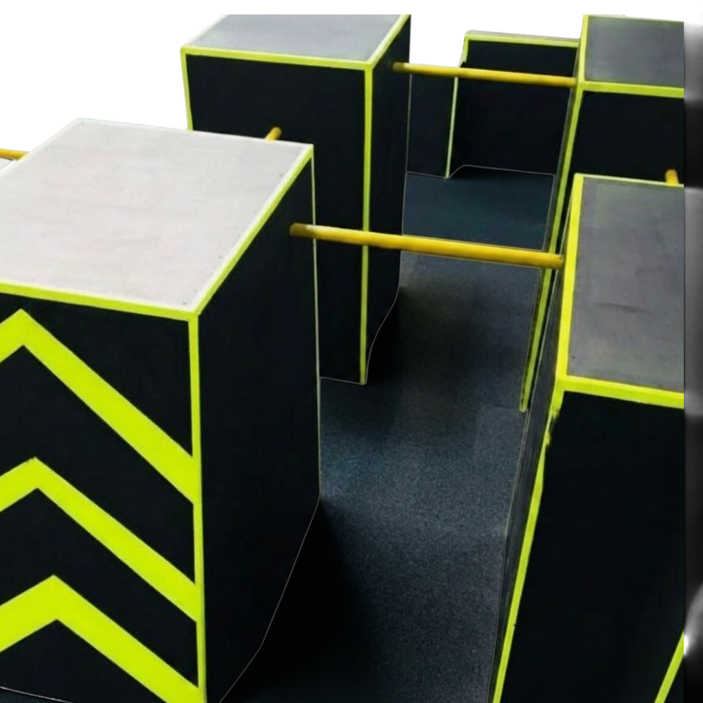 UK Gym Pits freestyle urban gym parkour blocks with black and yellow chevron design and connecting yellow swing bars