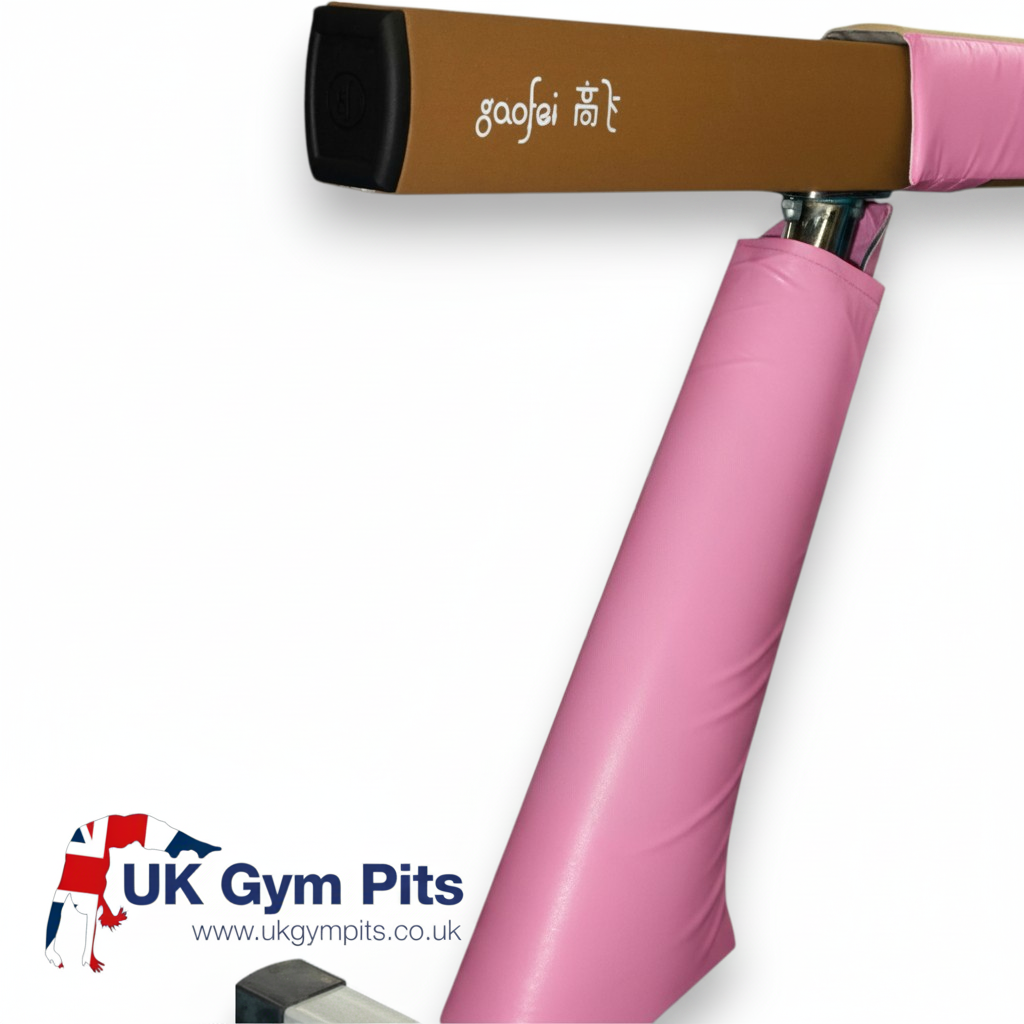 UK Gym Pits pink PVC vinyl safety padding fitted around a Gaofei gymnastics beam leg for impact protection