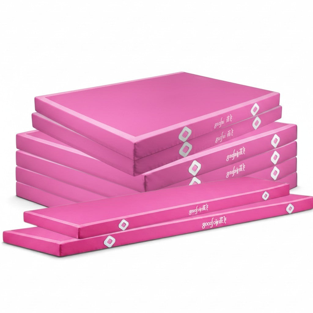 UK Gym Pits pink parallel bars landing mats stacked in a set of eight with durable PVC vinyl and Velcro connectors.