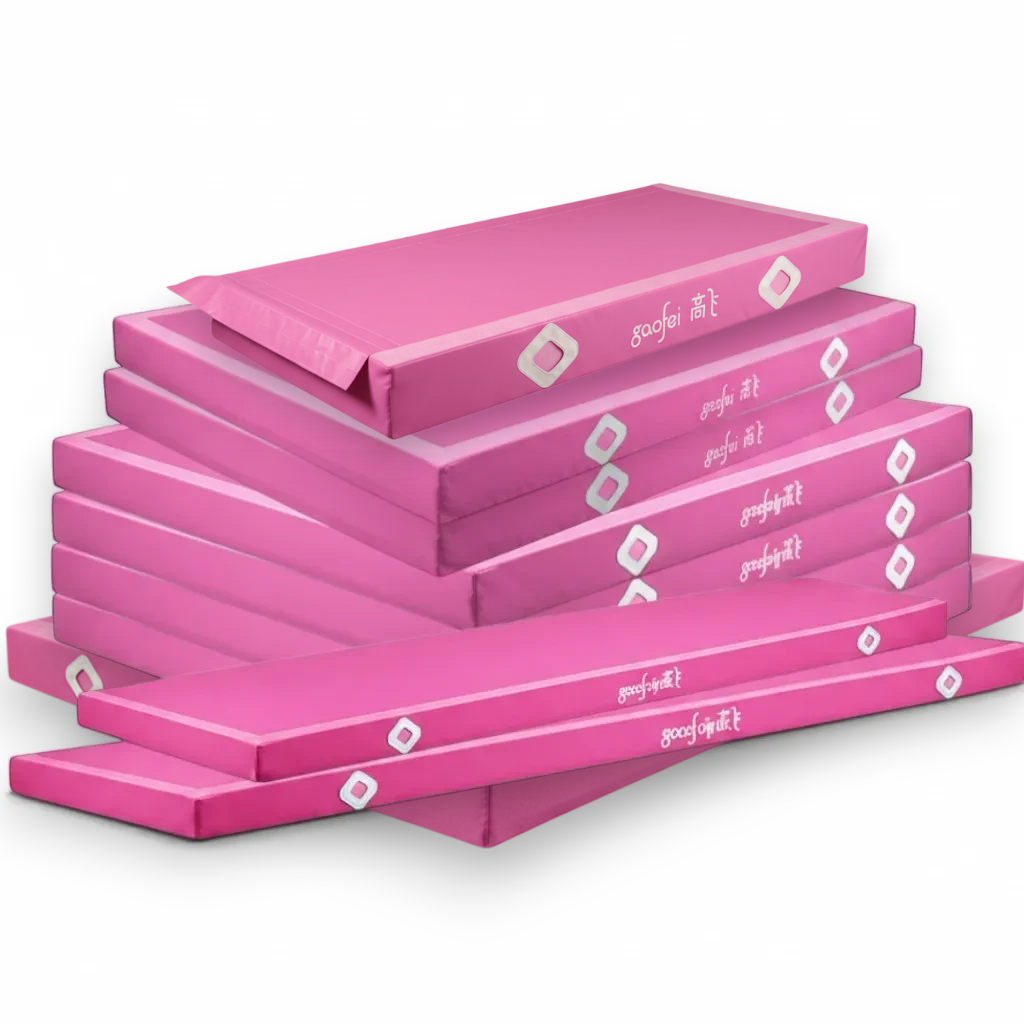 UK Gym Pits pink FIG approved parallel bars landing mats stacked for training and competition use.