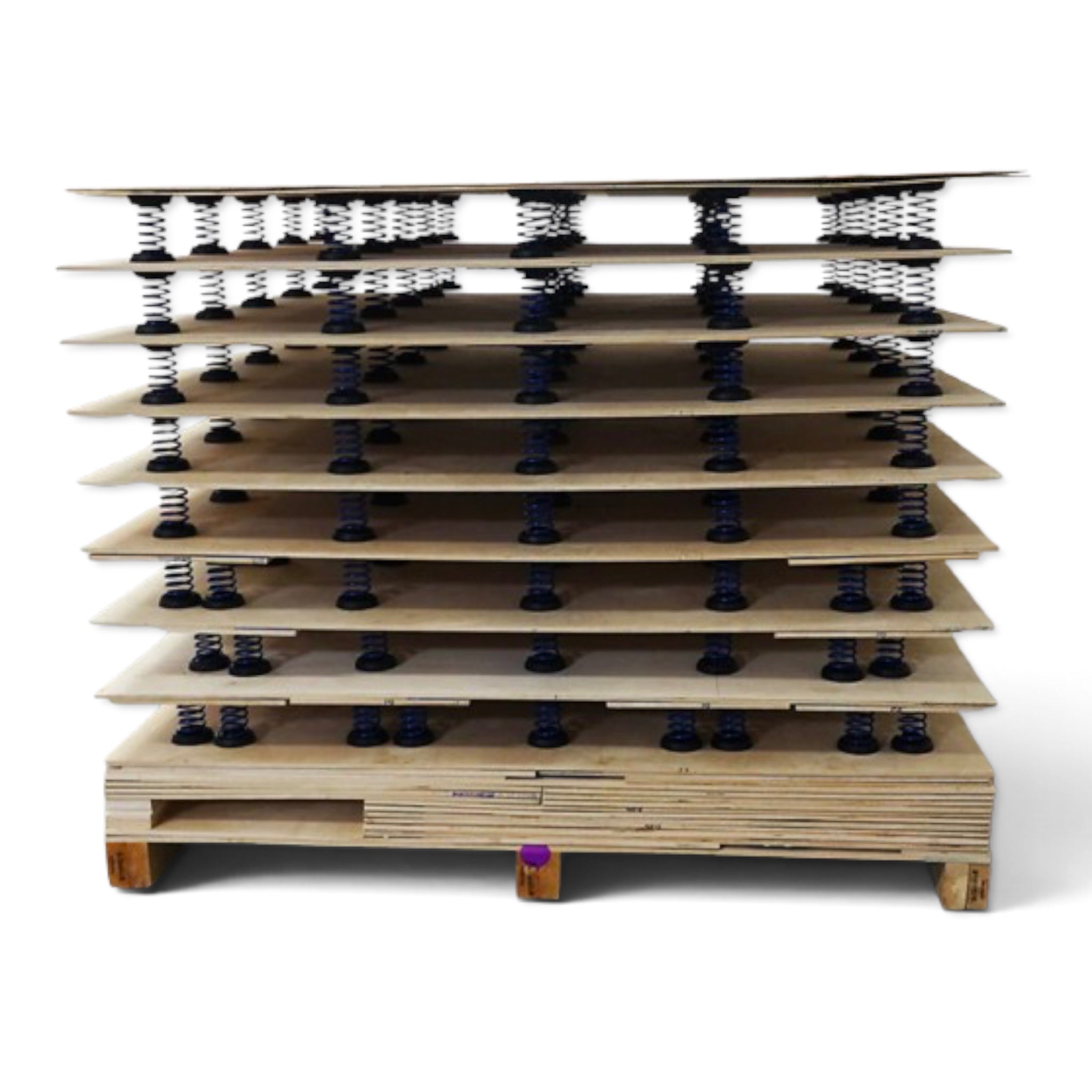 UK Gym Pits power spring floor kit components stacked on a pallet, featuring high carbon steel coils and caps.