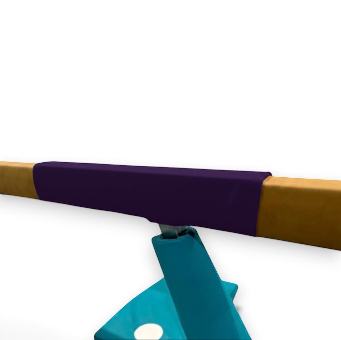 UK Gym Pits purple cushioned beam mat wrapped around a wooden gymnastics beam for shock absorption and safety.