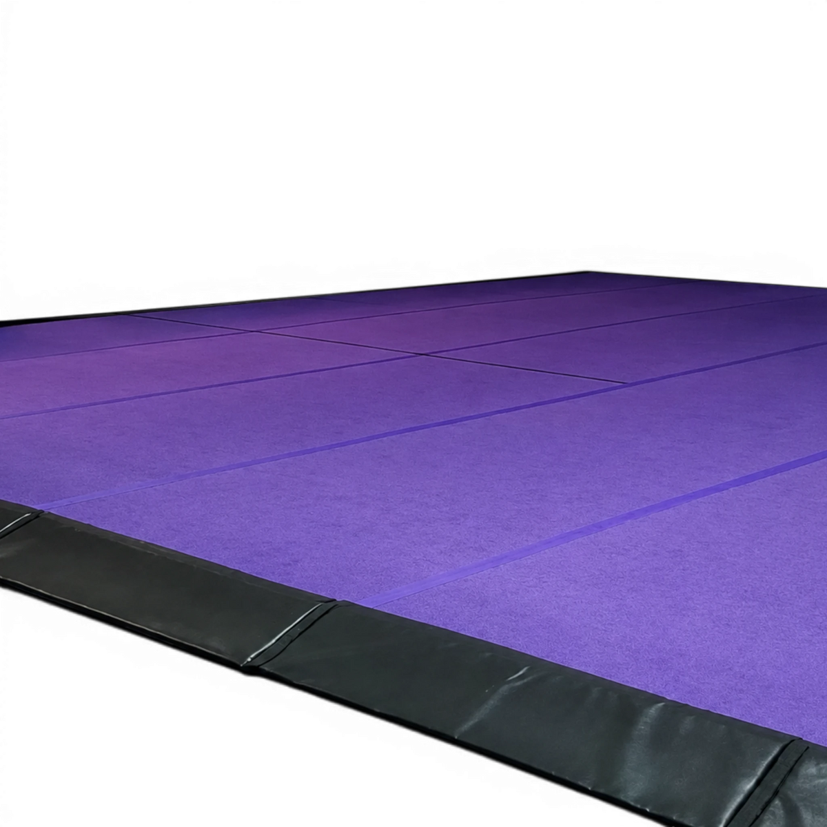 UK Gym Pits purple cheerleading sprung floor with black side skirts for training and competition use.