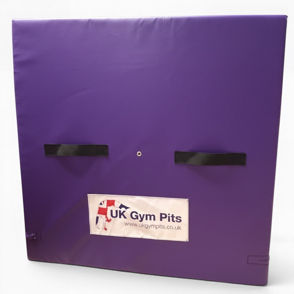 UK Gym Pits purple PVC spotting and coaching block with black carry handles and anti-slip base for gymnastics