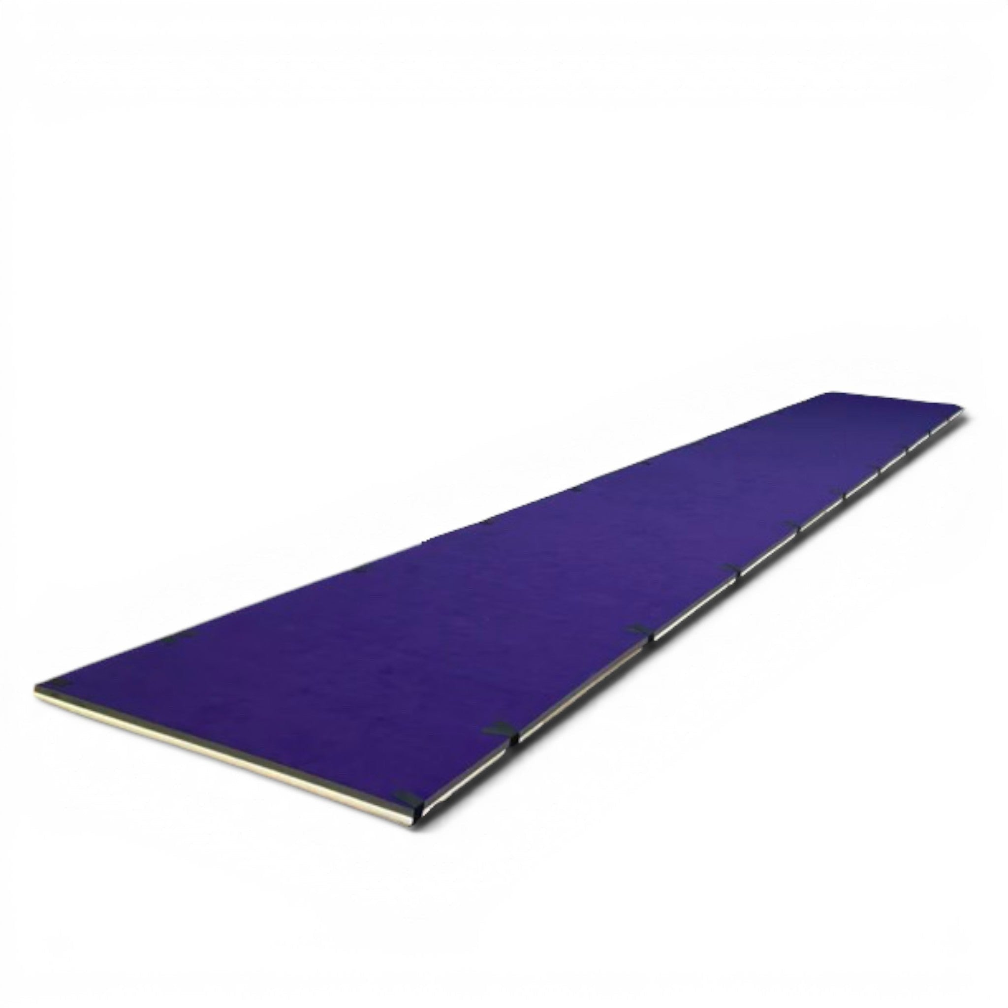 UK Gym Pits purple sprung tumble floor for gymnastics training and competition with a durable carpet surface.