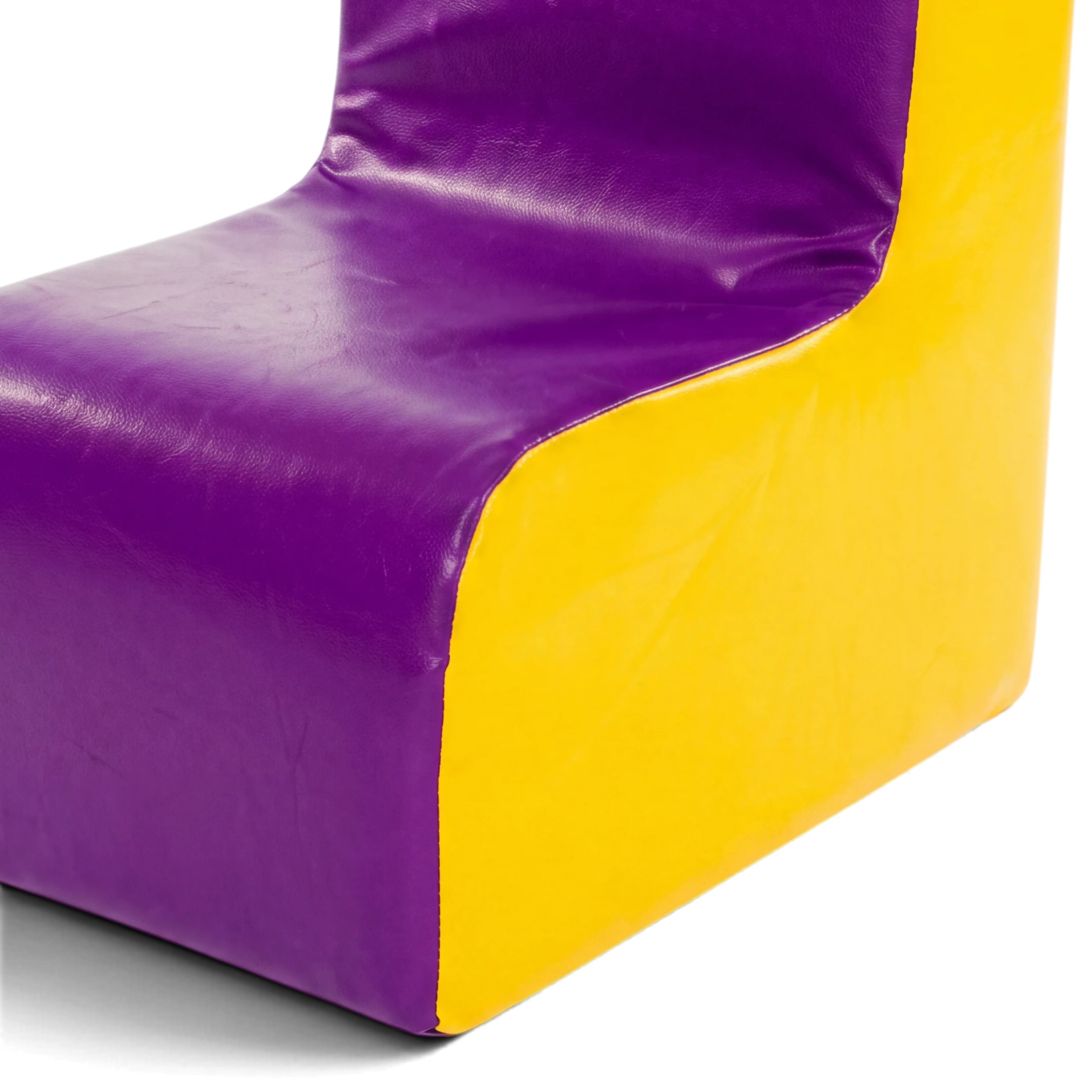 UK Gym Pits soft play chair in purple and yellow vinyl, designed for schools and nurseries with durable foam.