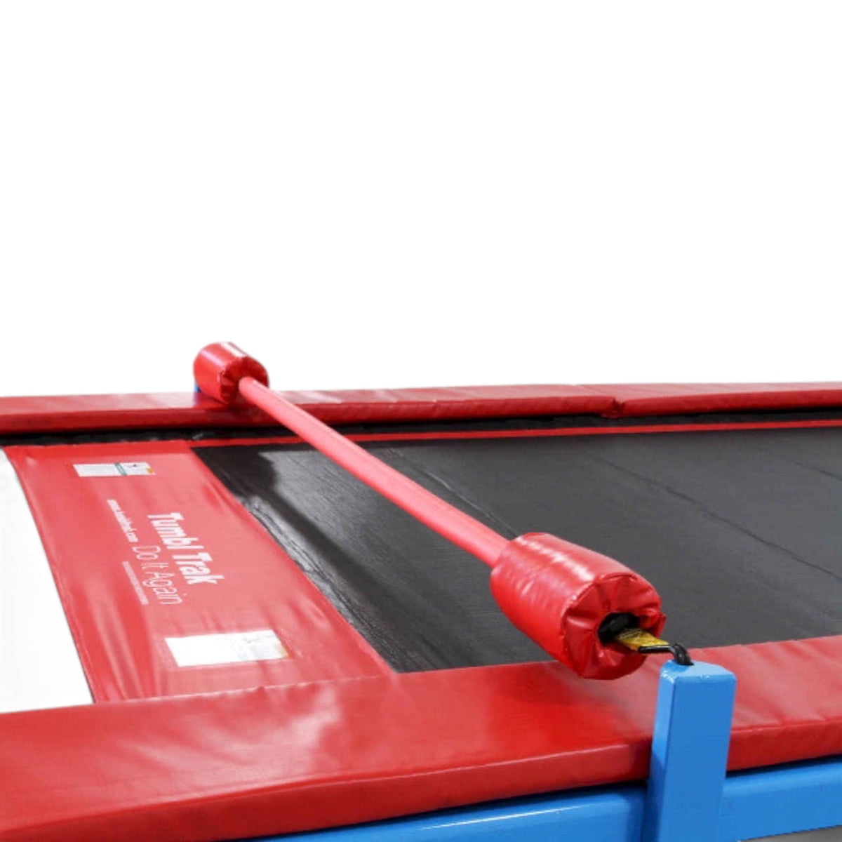 UK Gym Pits Quick Flex bar with red foam padding attached to a Tumbl Trak for gymnastics training