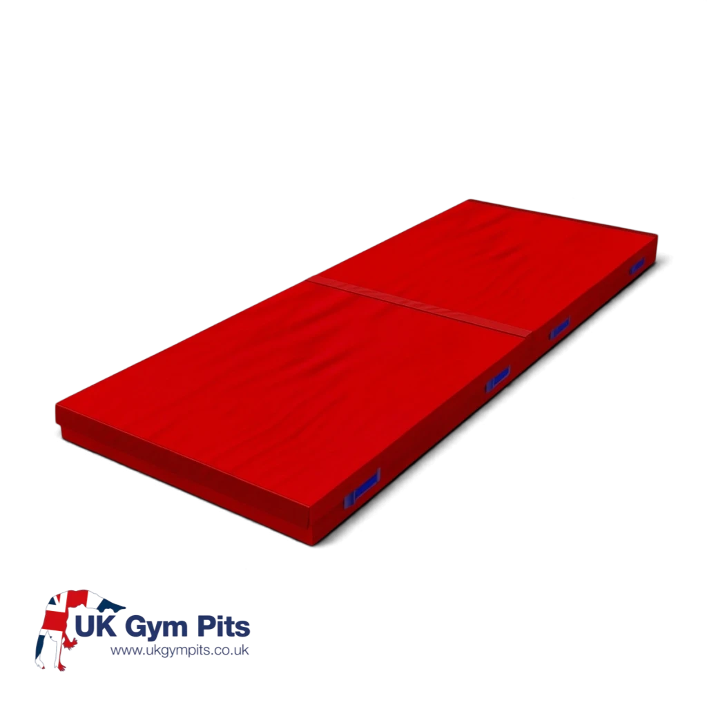 UK Gym Pits red connecting safety mat with heavy-duty handles and shock-absorbing foam for gymnastics and martial arts.