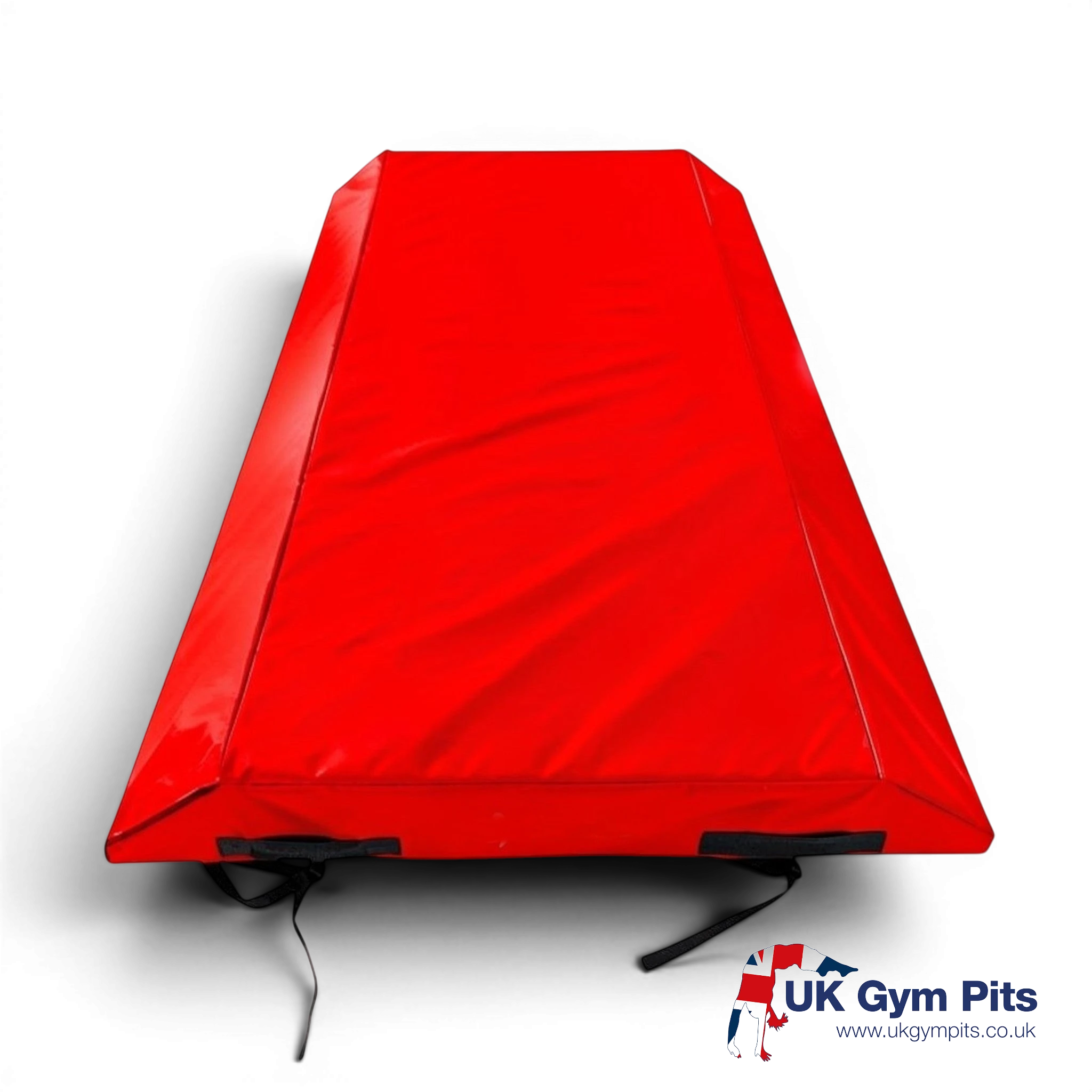 UK Gym Pits red double wedge trampoline spotting end deck mat with reinforced PVC cover and secure webbing straps.