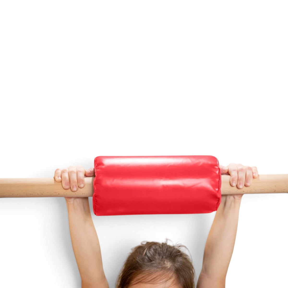 UK Gym Pits red vinyl gymnastics bar padding wrapped around a wooden training bar with hands gripping it