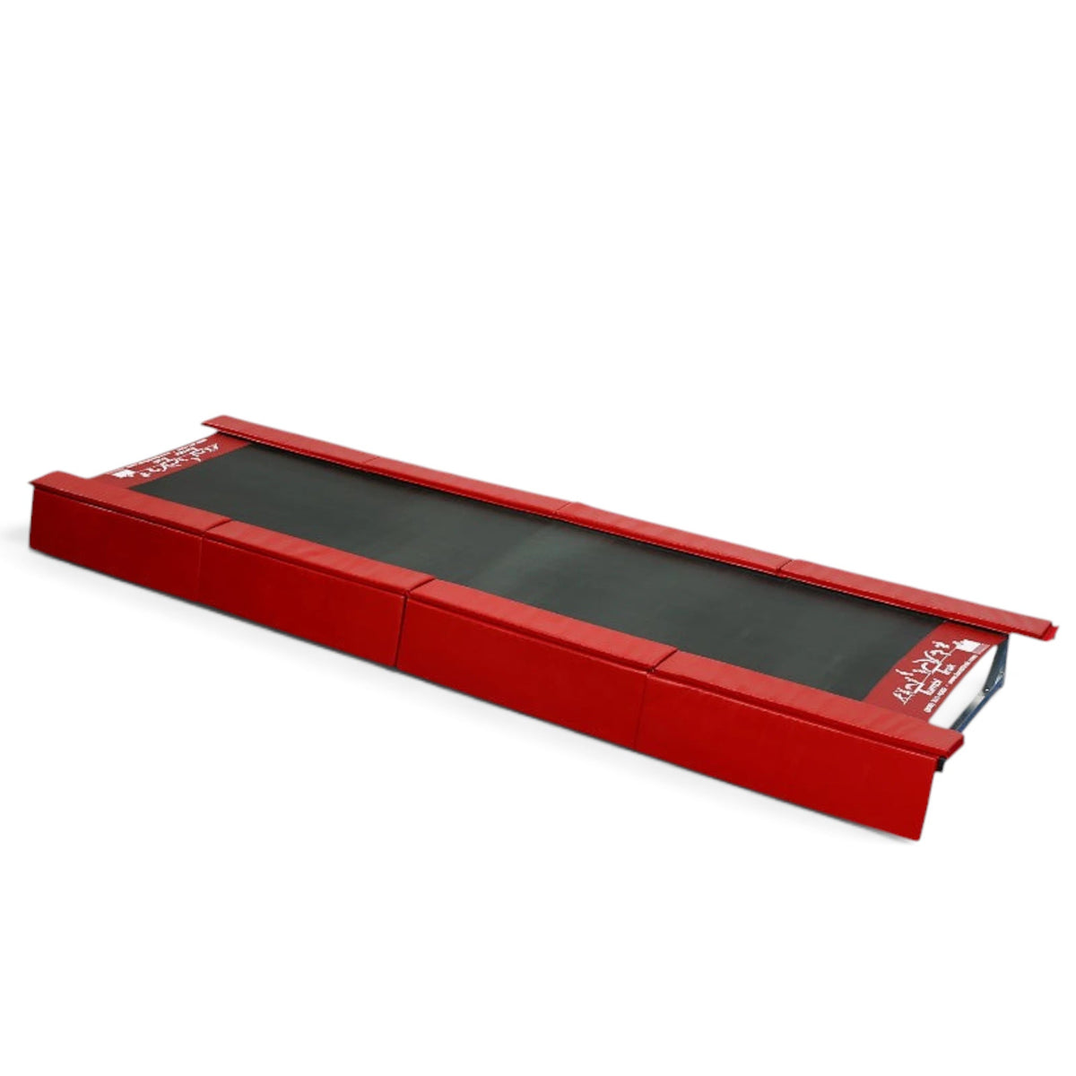 UK Gym Pits red padded vinyl safety skirts attached to the sides of a Tumbl Trak gymnastics training mat