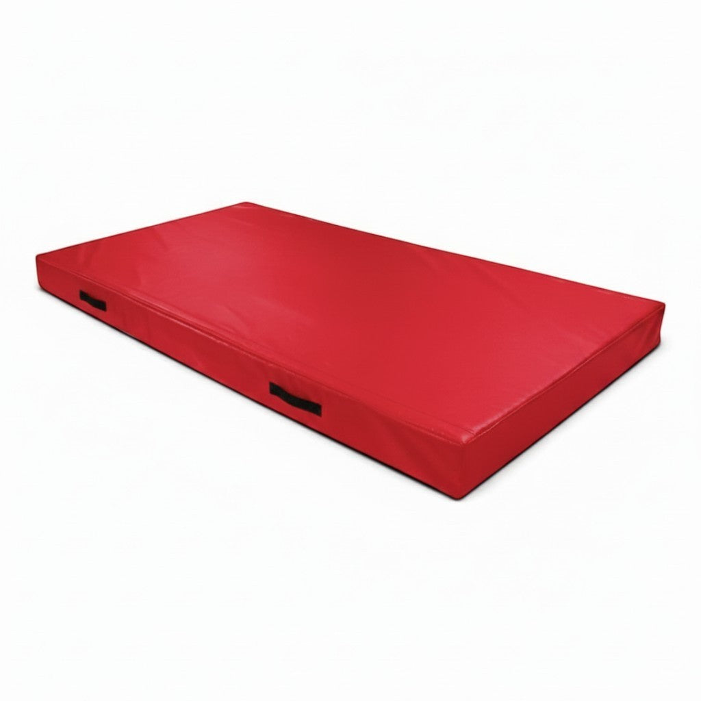 UK Gym Pits red rectangular push-on safety mat with black side handles and reinforced PVC cover for trampoline use