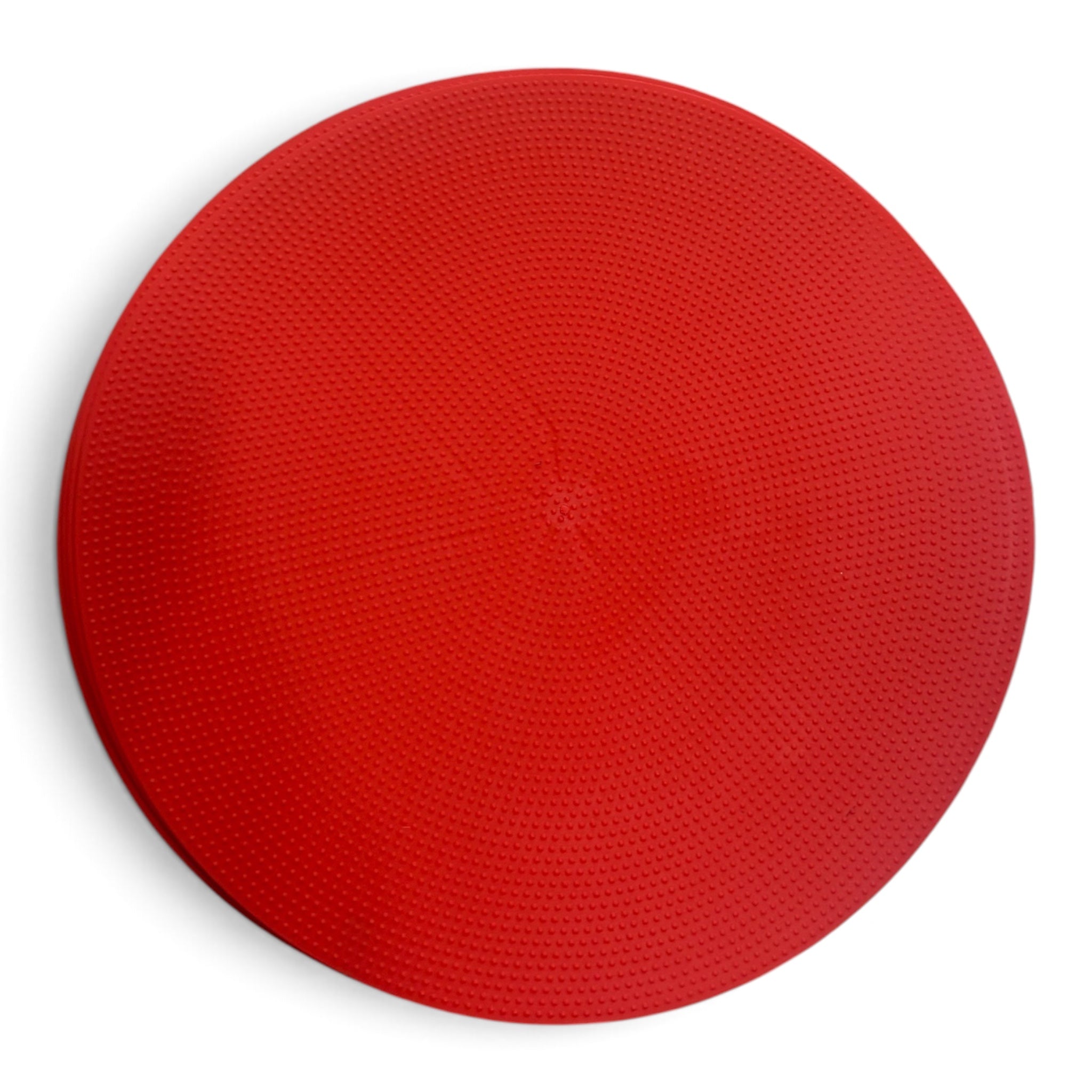 UK Gym Pits red circular TPR spot placement marker with a non-slip dimpled texture for sports and classroom activities.