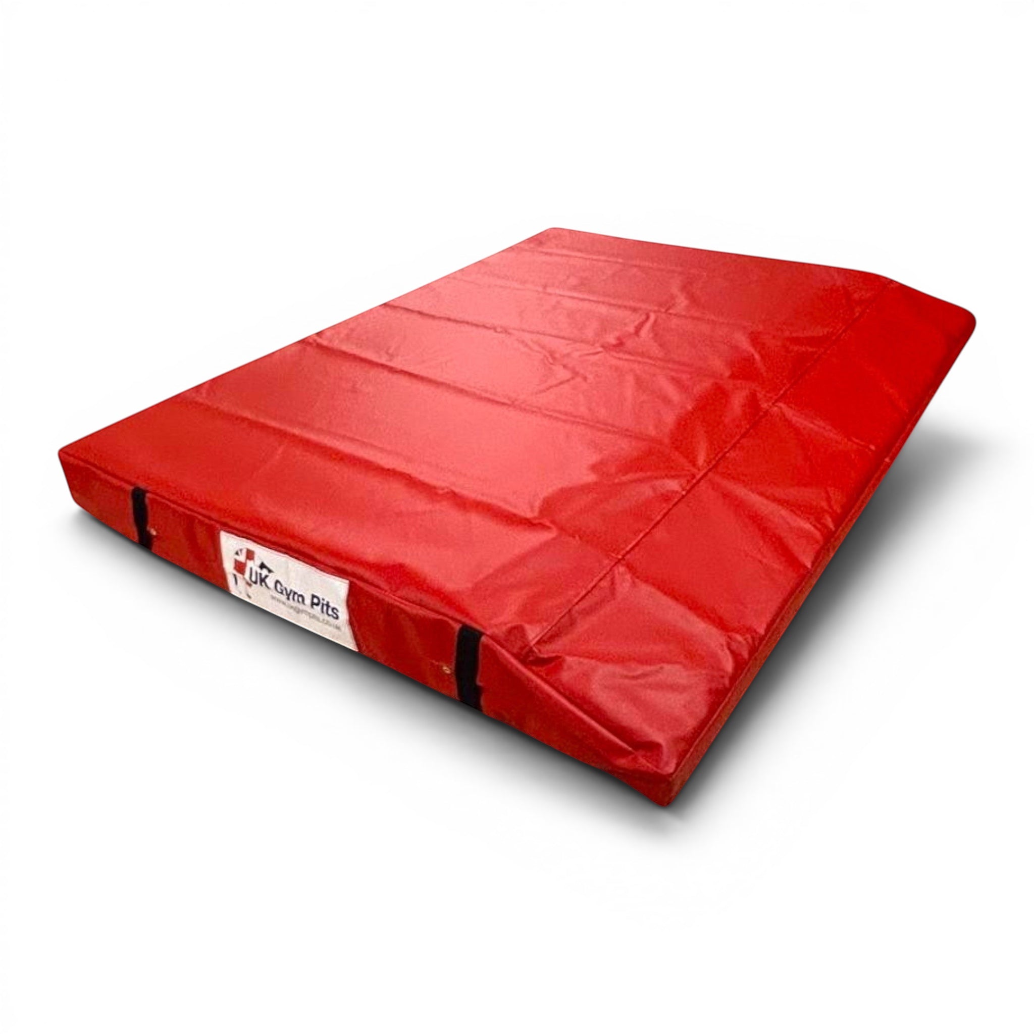 UK Gym Pits red single wedge trampoline spotting end deck mat with reinforced PVC cover and secure webbing straps.
