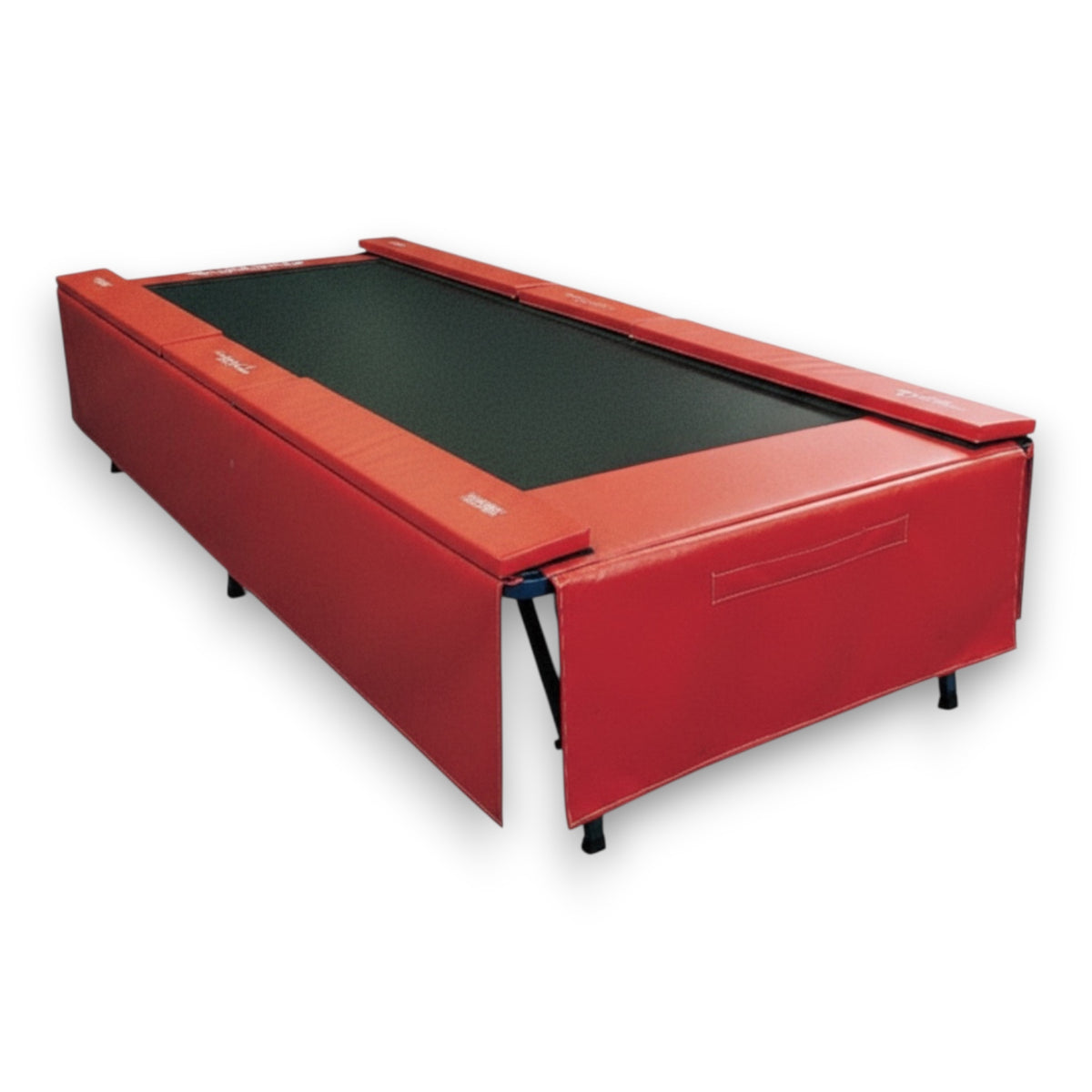 UK Gym Pits standard red vinyl skirt attached to the side of a Tumbl Trak gymnastics frame for a clean finish.
