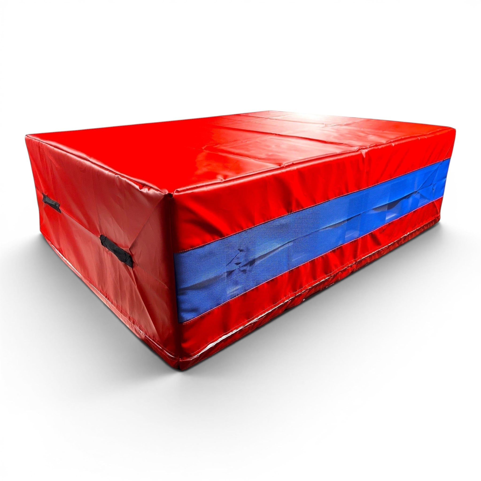 UK Gym Pits red and blue shock-absorbing resi foam landing pit with heavy-duty handles and mesh side ventilation.