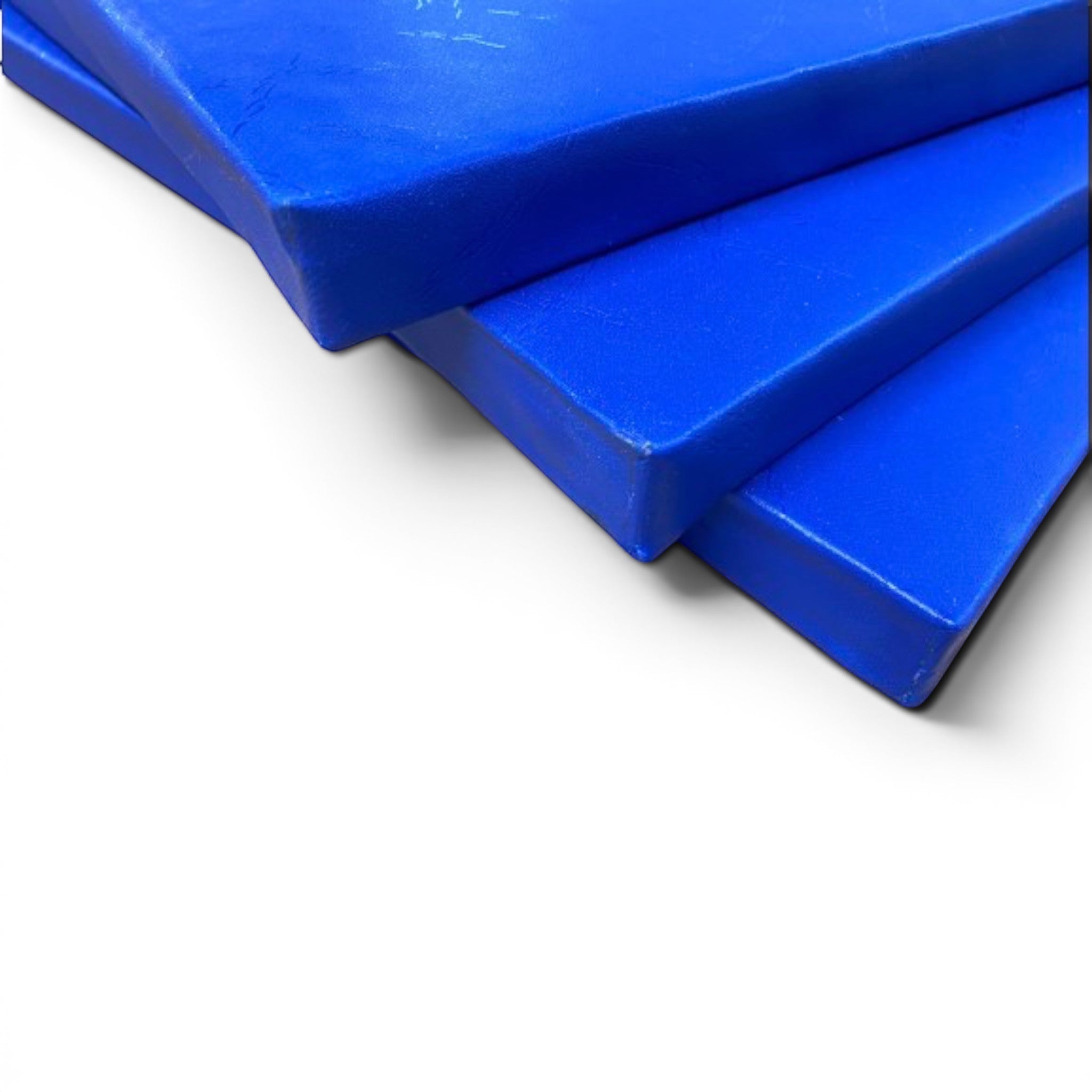 UK Gym Pits royal blue shock-absorbing foam padding sheets with heavy-duty PVC cover for gym walls and pits.