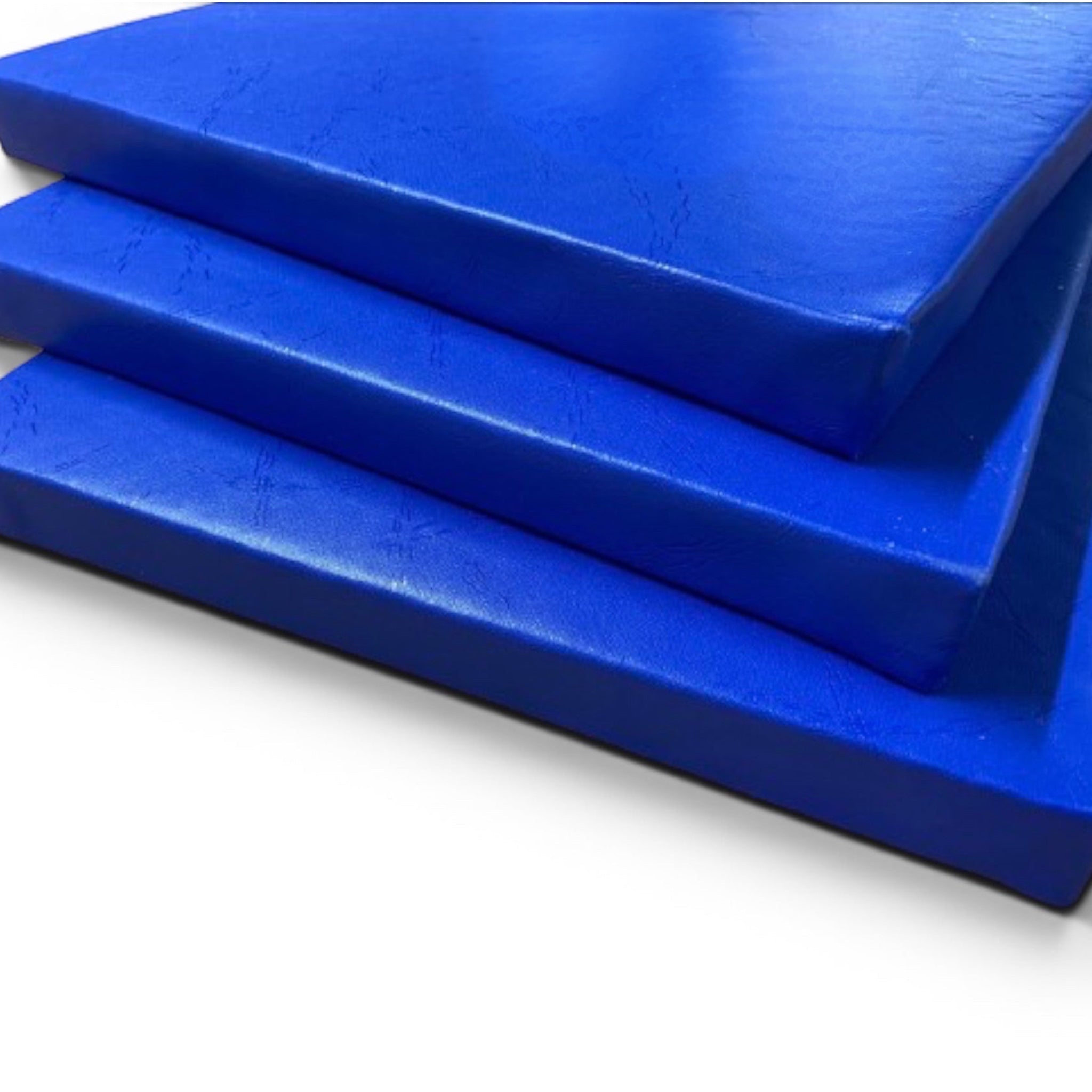 UK Gym Pits royal blue shock-absorbing foam padding sheets with heavy-duty PVC cover for gym walls and pits.