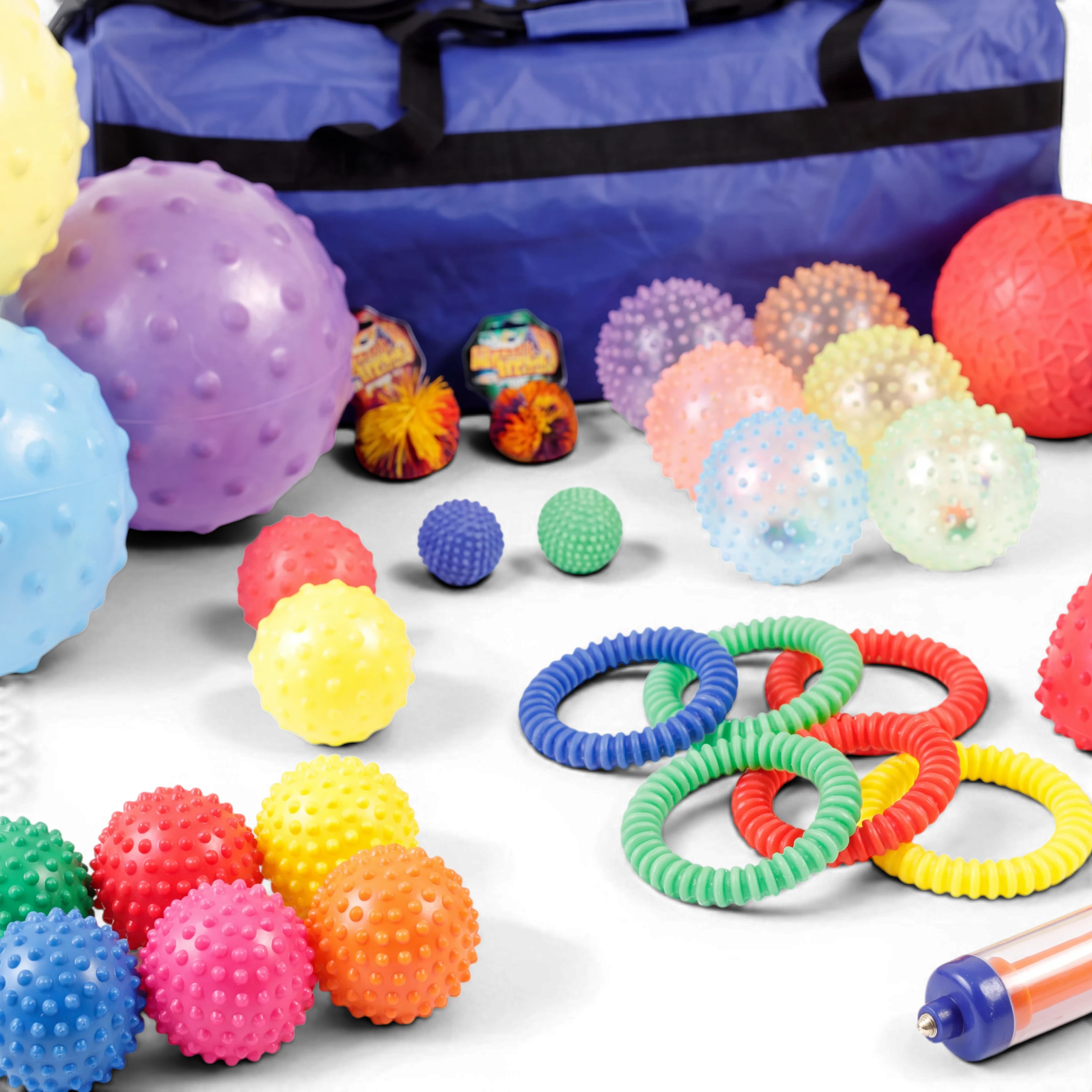 UK Gym Pits 35-piece sensory ball set with textured tactile balls, rings, and a blue storage holdall for motor skills.