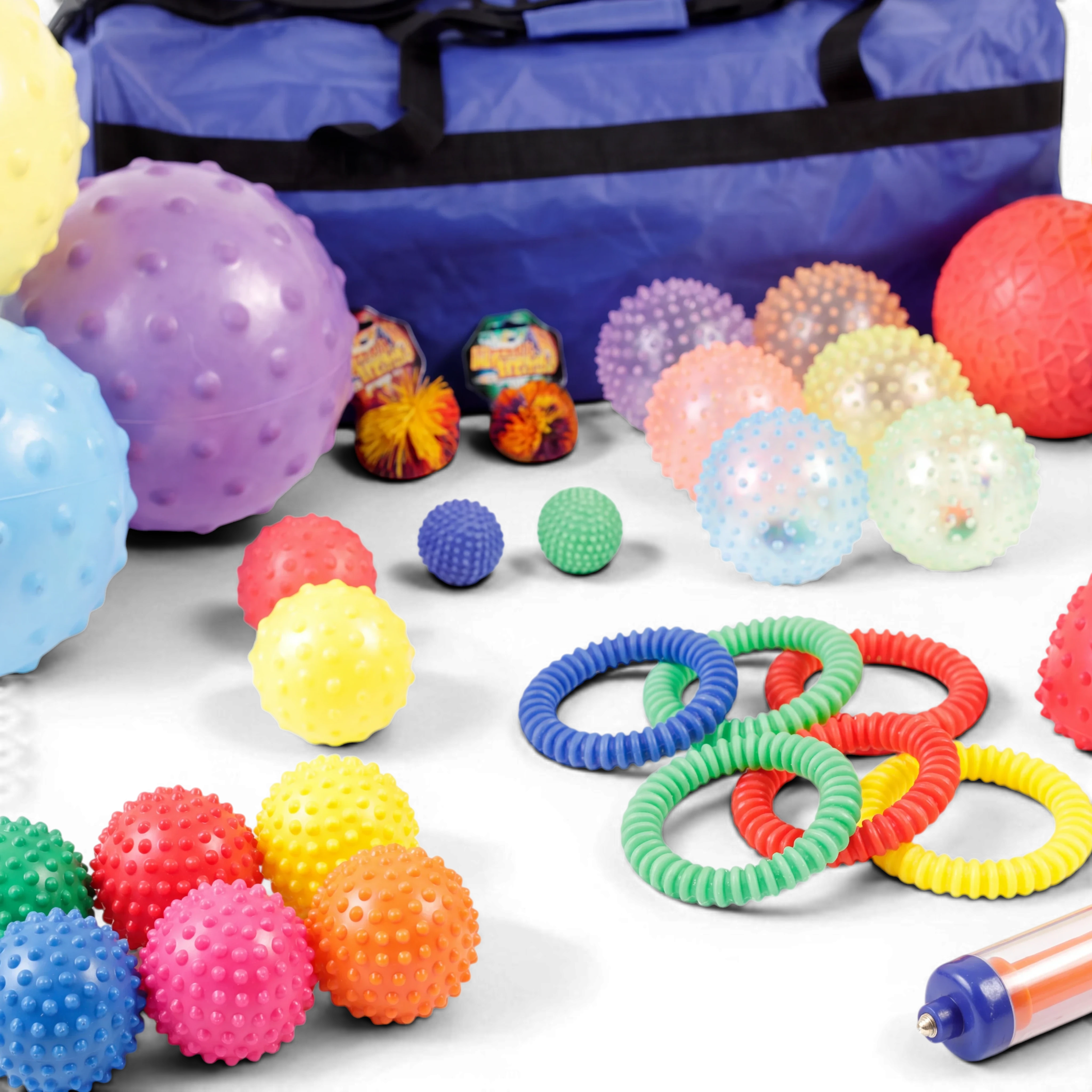 UK Gym Pits 35-piece sensory ball set with textured tactile balls, rings, and a blue storage holdall for motor skills.