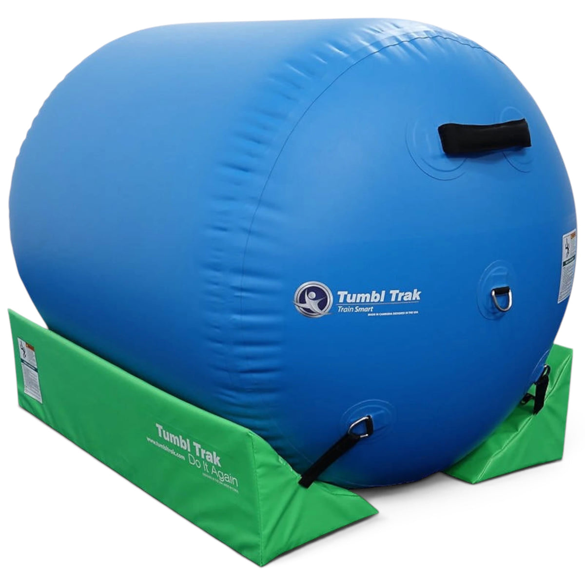 UK Gym Pits sky blue inflatable air barrel for gymnastics training resting in a green foam cradle stabilizer