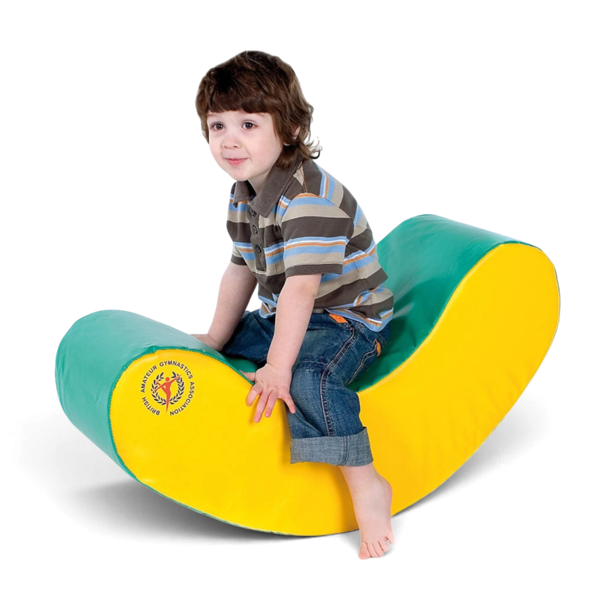 A young boy sitting on a yellow and green UK Gym Pits soft play banana rocker for gross motor skill development.