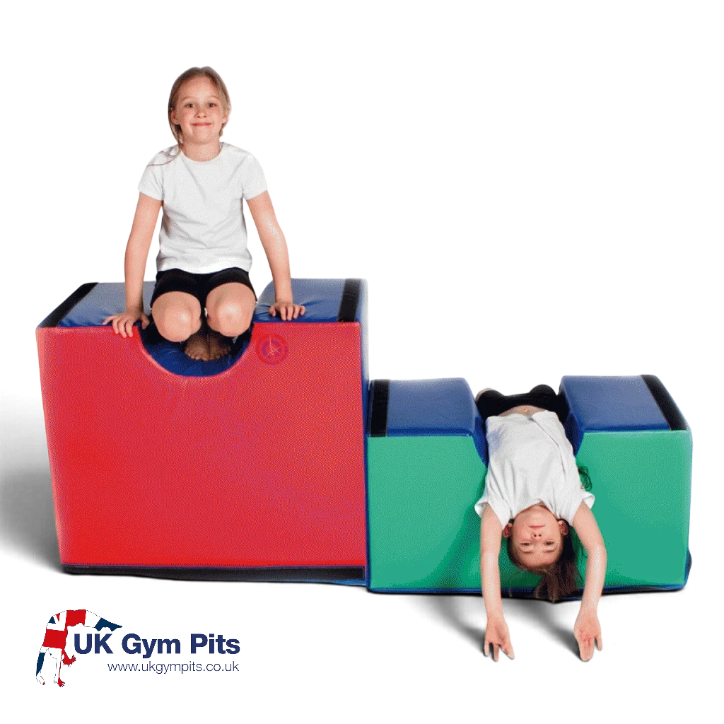UK Gym Pits soft play bridge set with children playing on large red and small green foam vaulting blocks