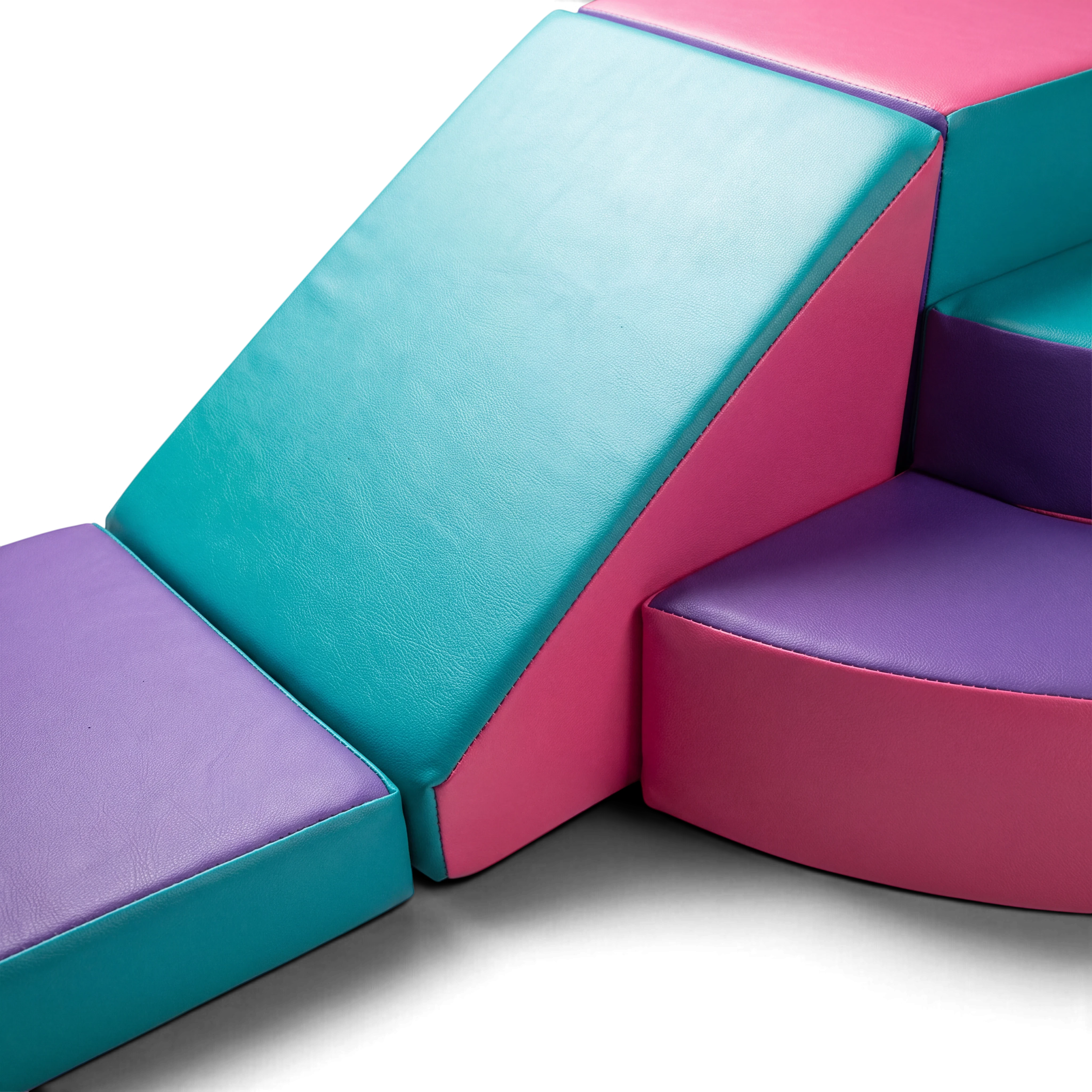 UK Gym Pits soft play corner set in pink, turquoise, and purple vinyl foam for children's motor skill development
