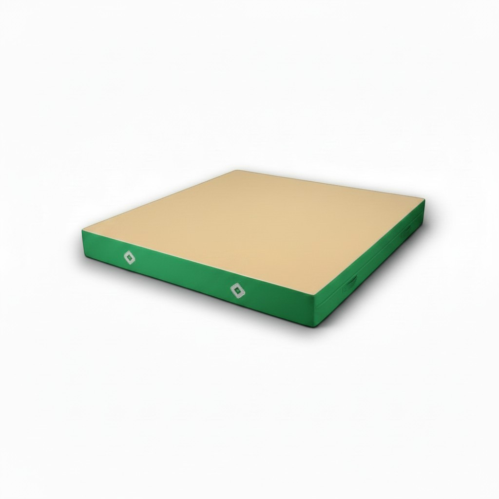 UK Gym Pits FIG approved soft topper landing mat with a beige jersey top and green PVC sides for gymnastics training