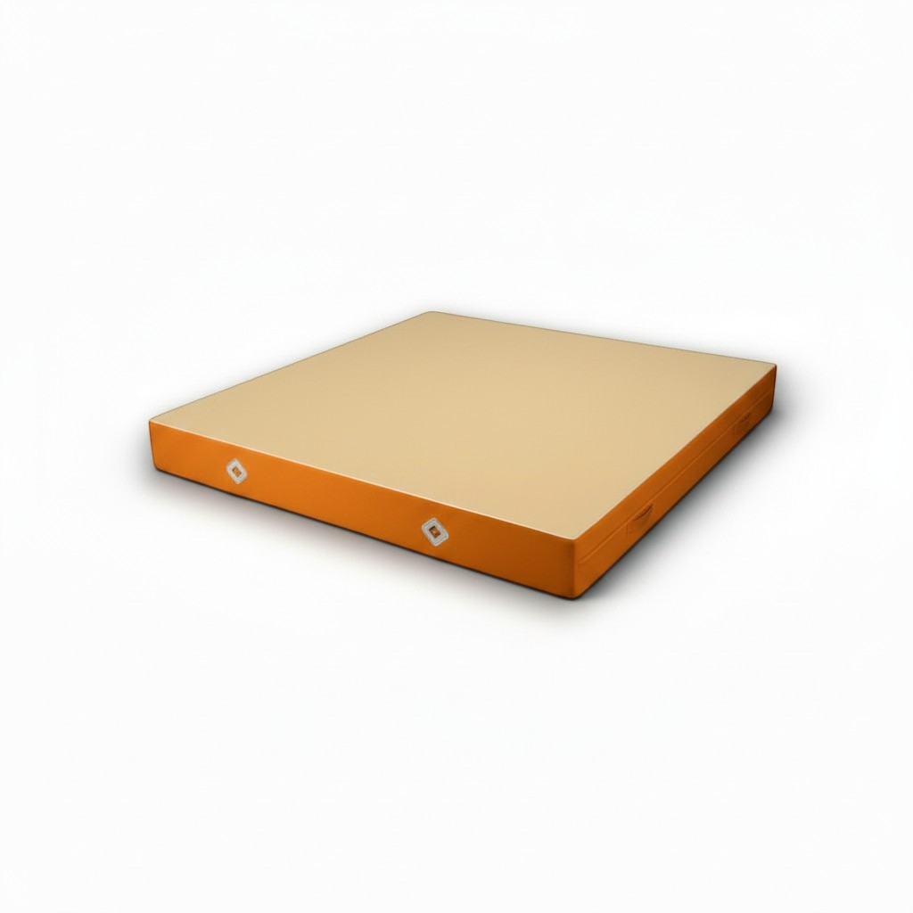 UK Gym Pits FIG approved soft topper landing mat with orange PVC sides and a soft beige jersey fabric top surface.
