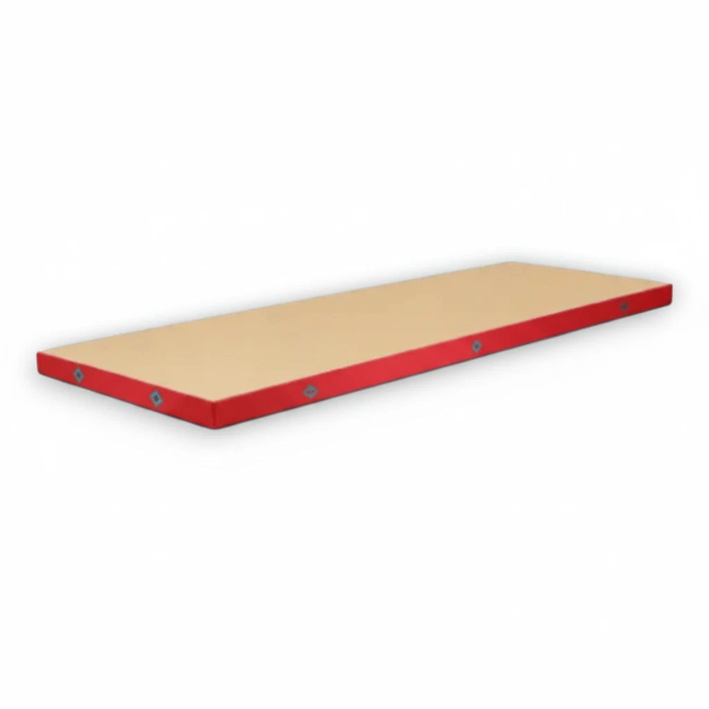 UK Gym Pits FIG approved soft topper landing mat with a beige jersey top and red PVC sides for gymnastics training.