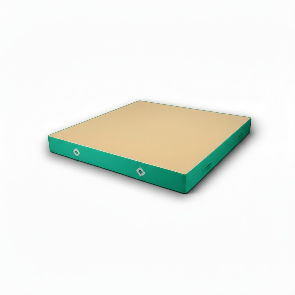 UK Gym Pits FIG approved soft topper gymnastics landing mat with a beige jersey top and green PVC sides.